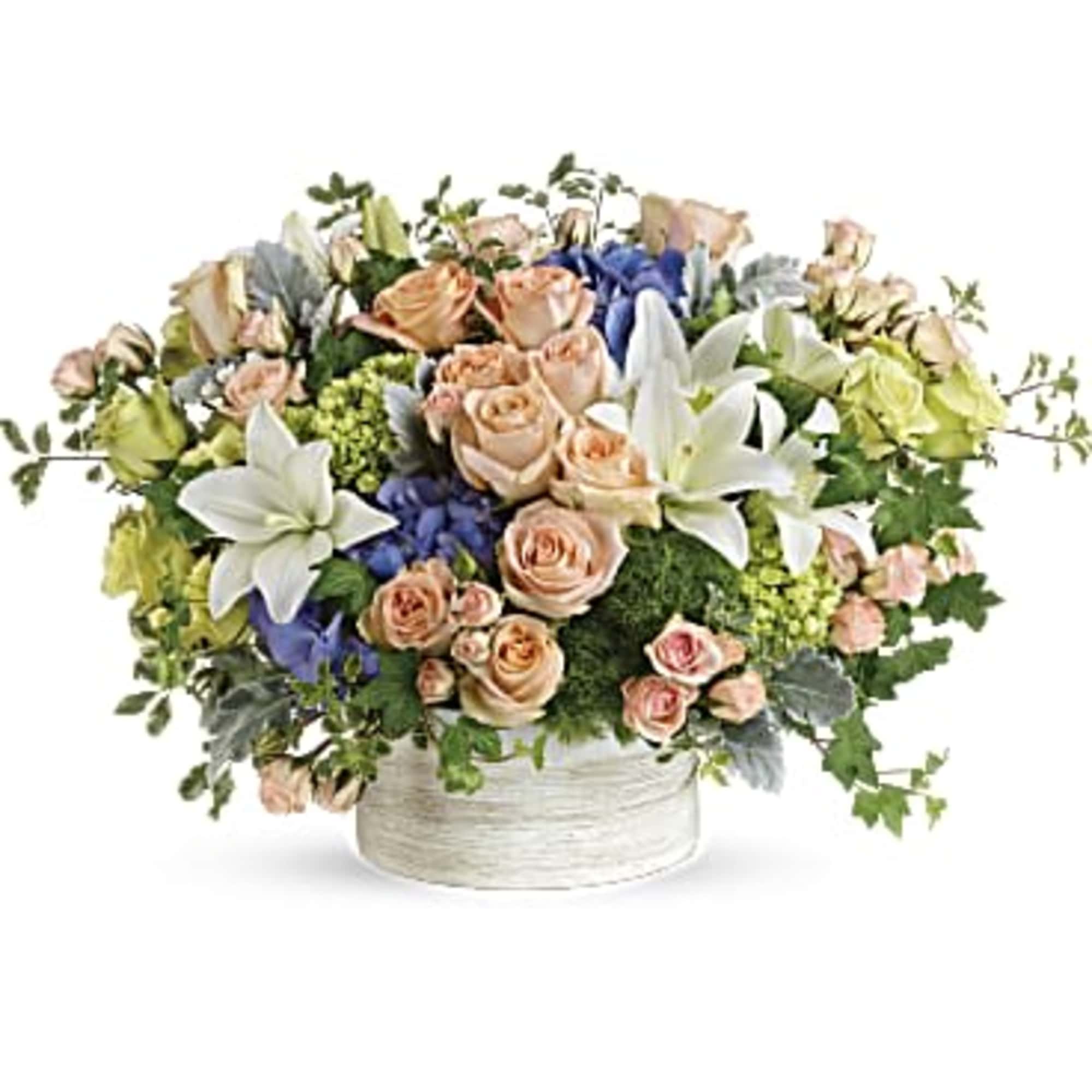 This gorgeous arrangement includes purple hydrangea, miniature green hydrangea, green roses, peach