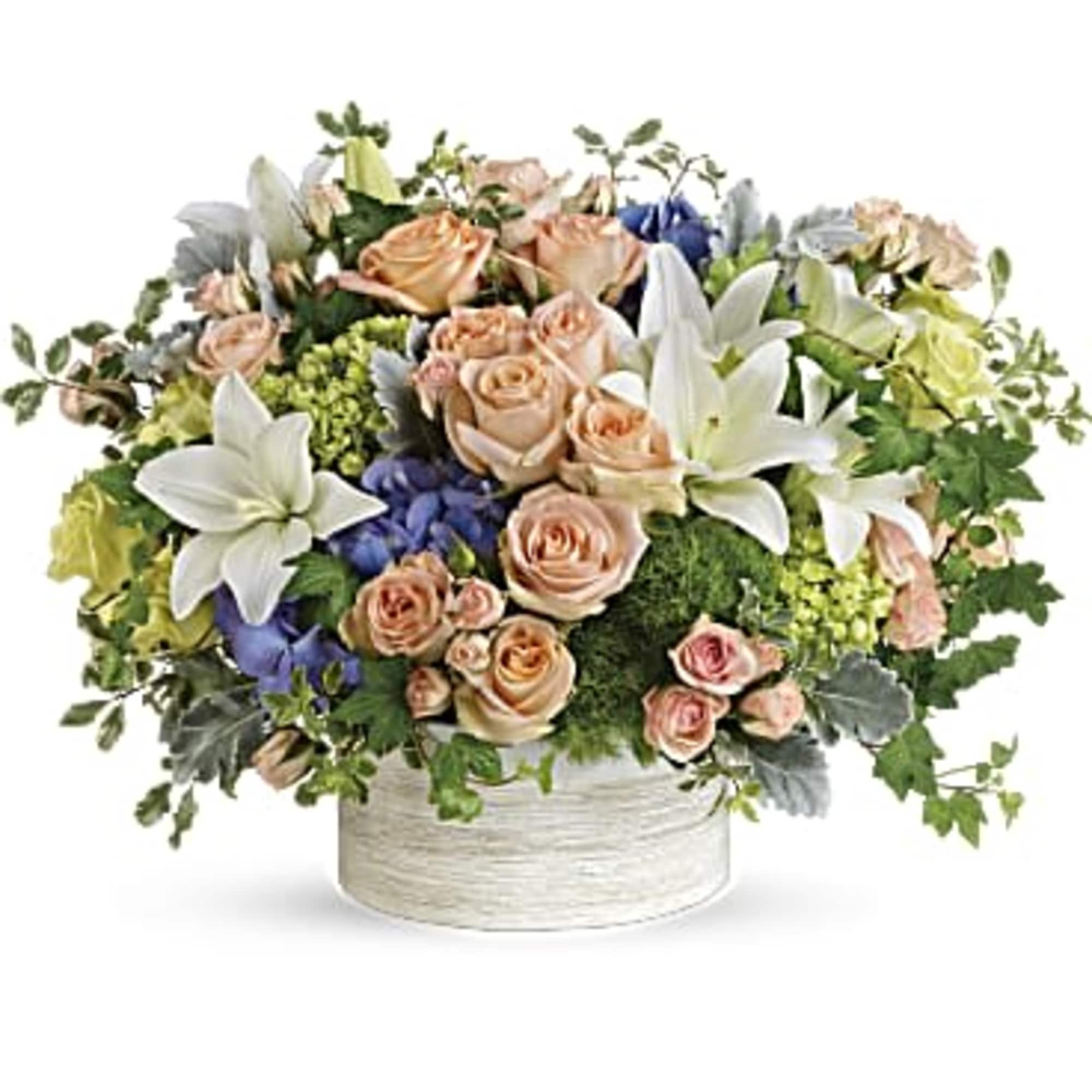 This gorgeous arrangement includes purple hydrangea, miniature green hydrangea, green roses, peach
