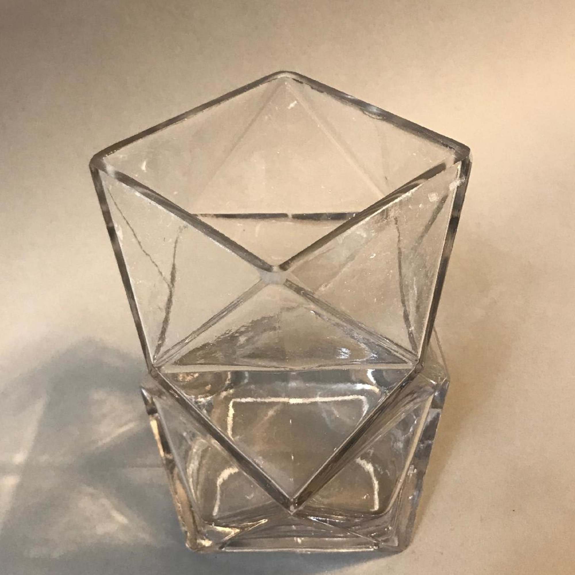 loose garden design in modern angular vase assorted blooms of roses, carnations