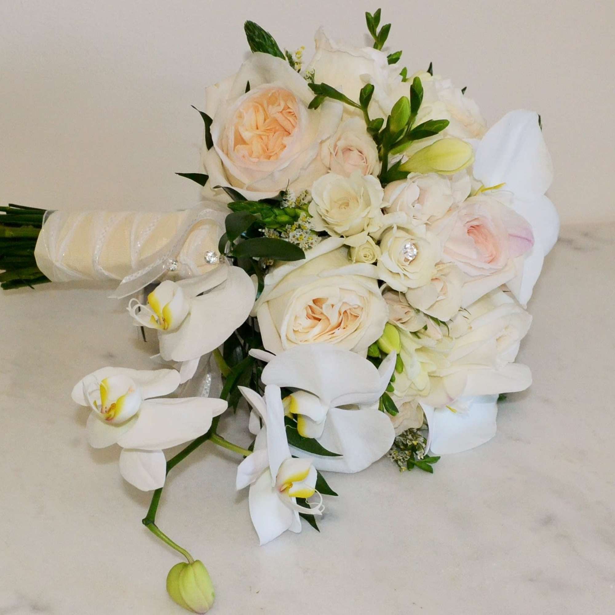 beautiful hand wrapped bouquet with garden roses and orchids.
Flowers and similar colors beautiful hand wrapped bouquet with garden roses and orchids.
Flowers and similar colors
