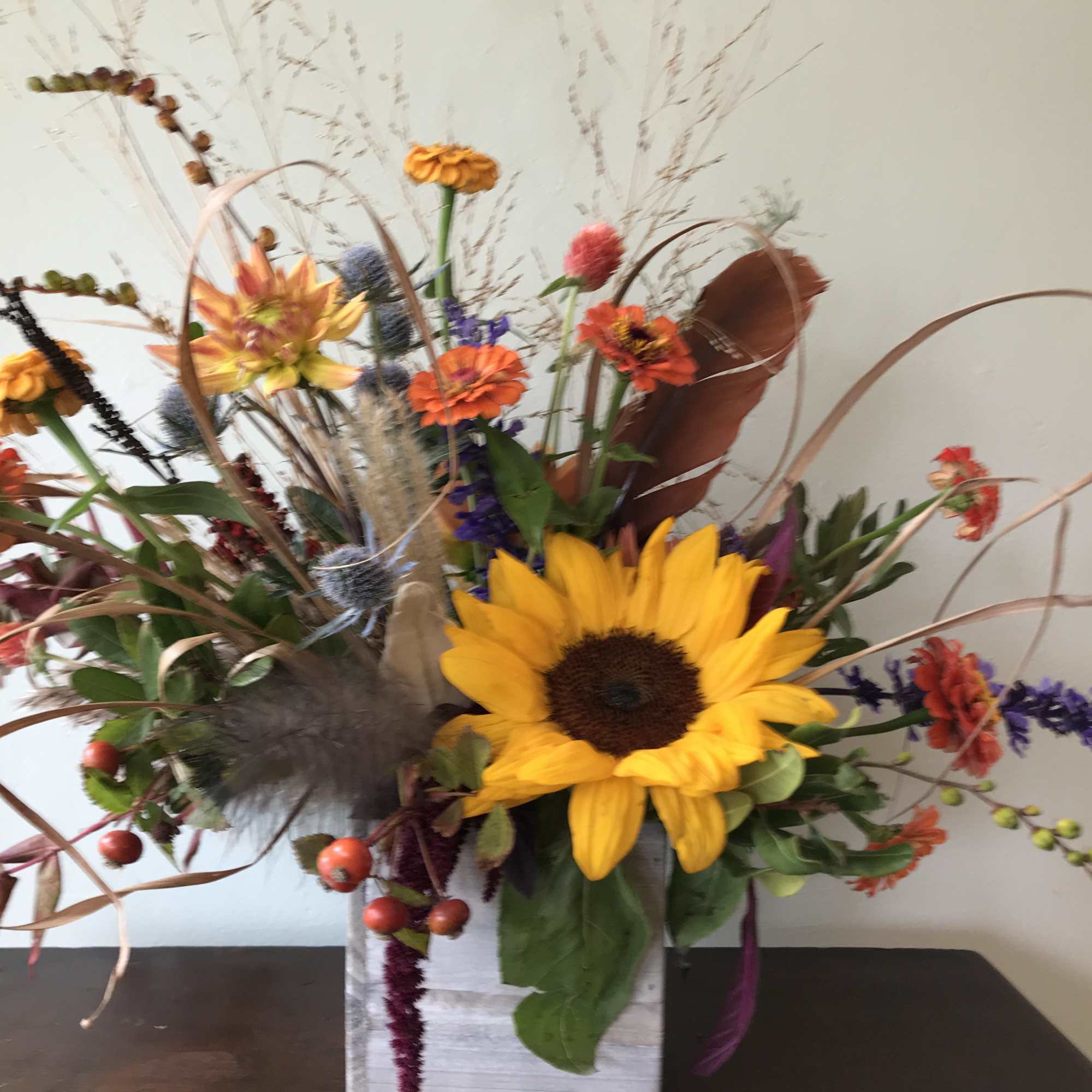 A one of a kind seasonal flower arrangement beautifully designed using in