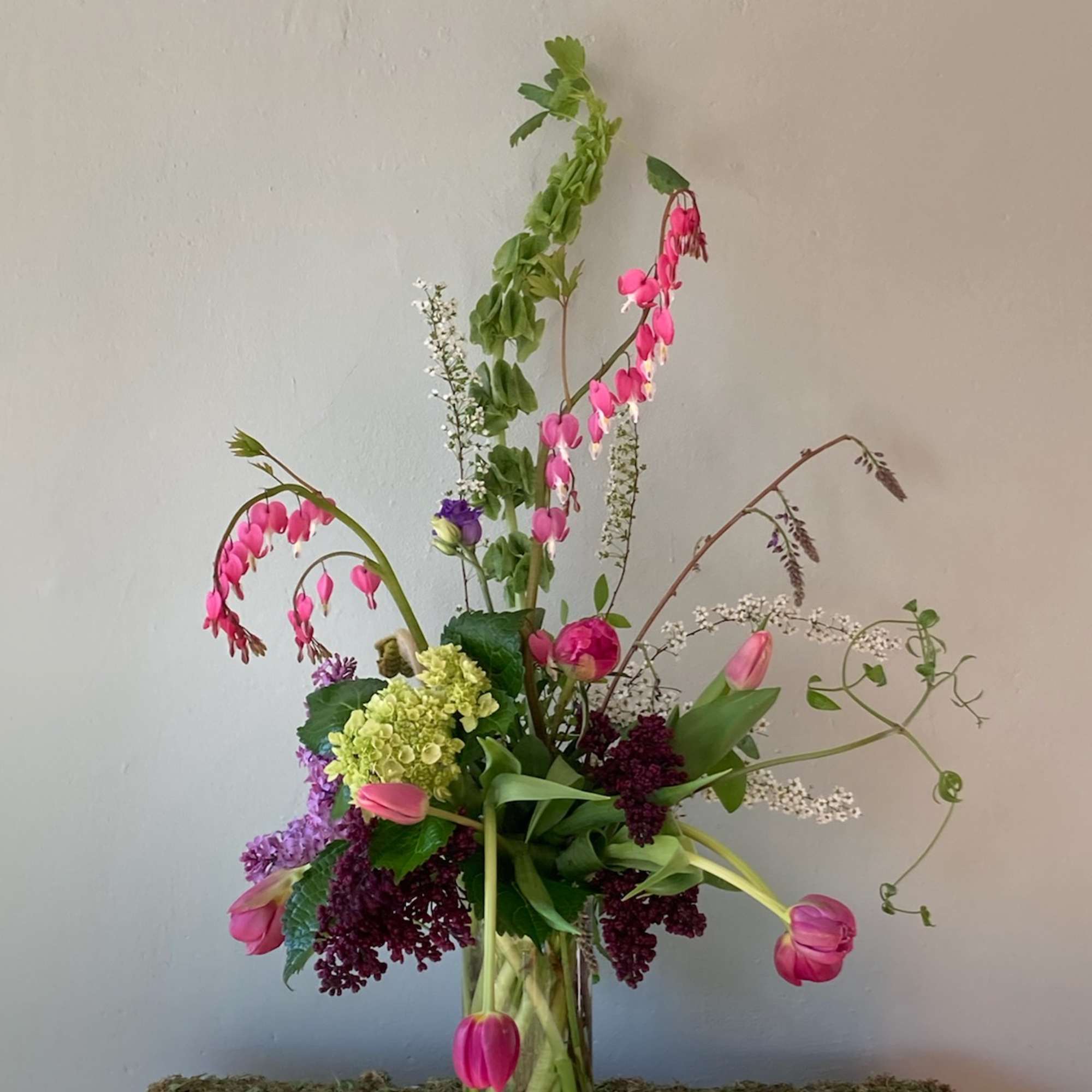 A one of a kind seasonal flower arrangement beautifully designed using in