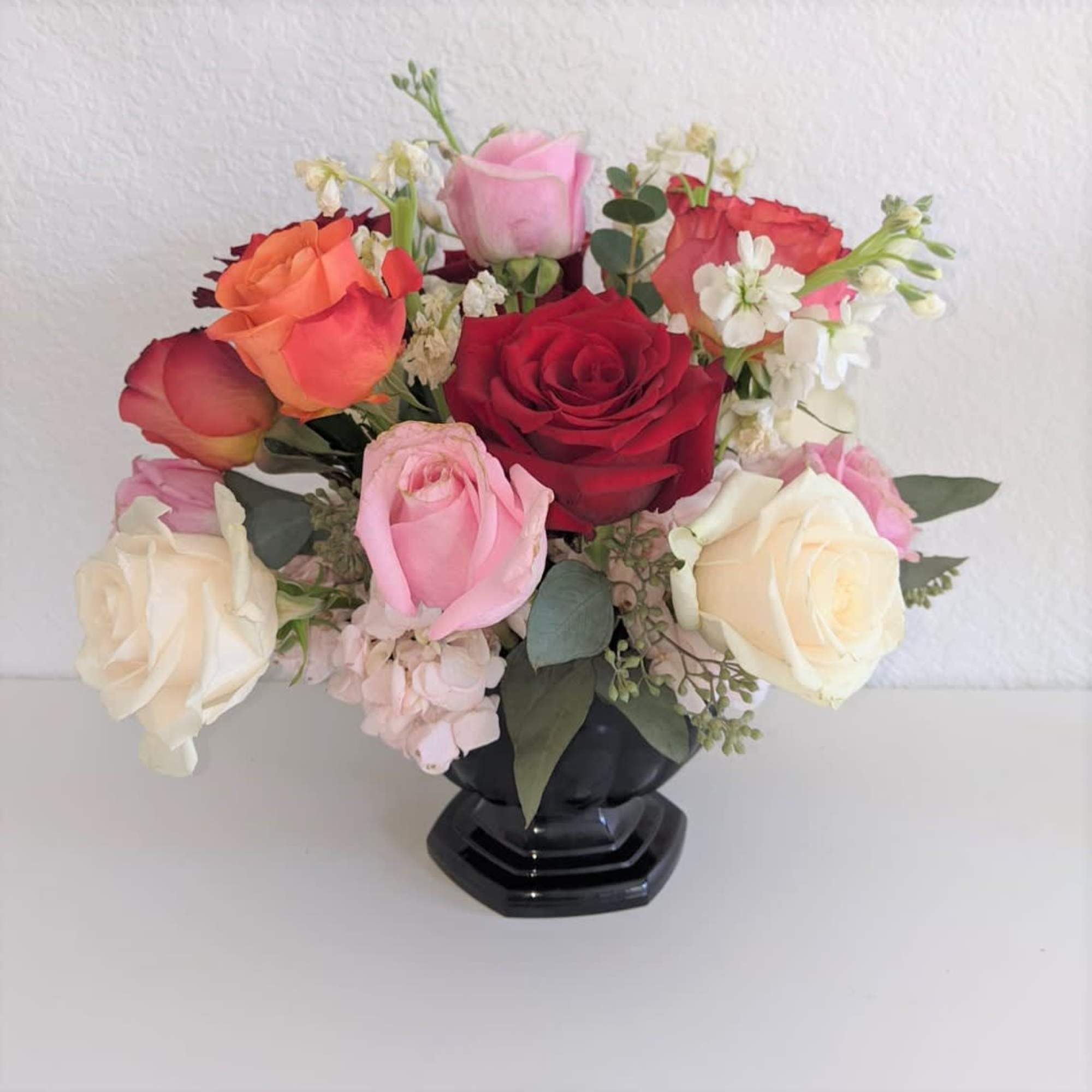 A very delightful cup of different roses and hydrangeas. Perfect for a