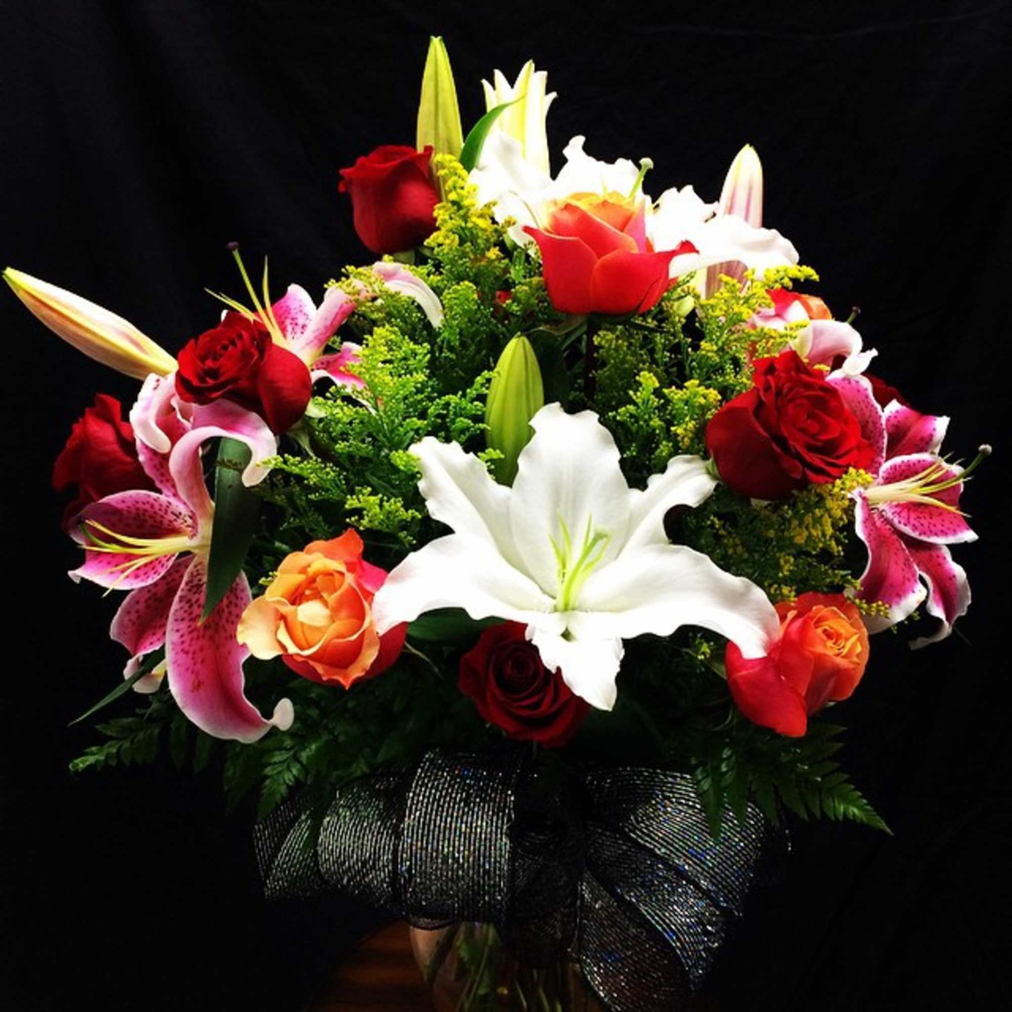 Send this amazing colorful,  assorted roses and mix lily arrangement  Send this amazing colorful,  assorted roses and mix lily arrangement