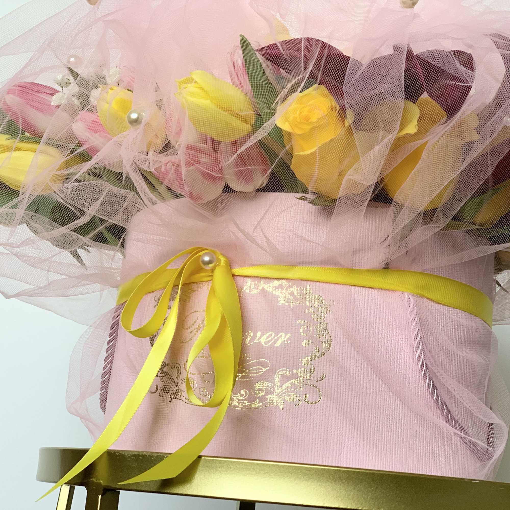 A box of flora arrangement wrapped in a tulle