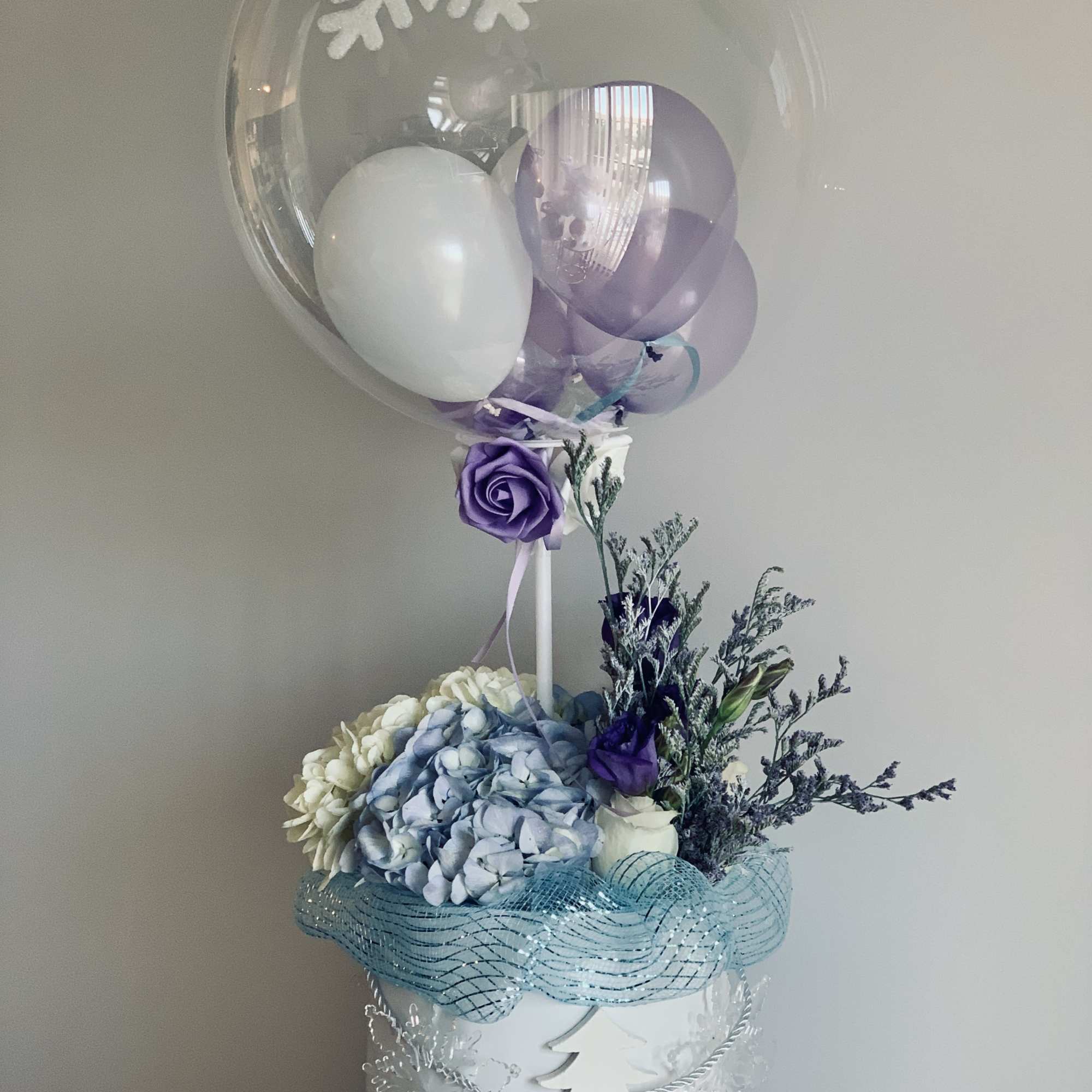 Thematic floral arrangement with a lot of accessories 