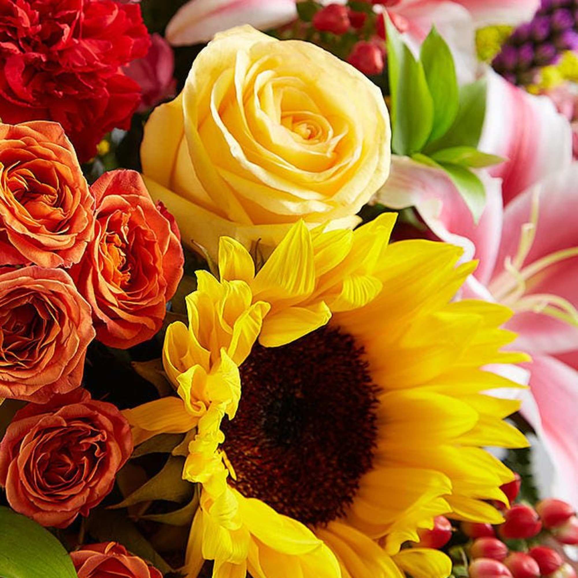 There&rsquo;s a warmth and radiance to our bright basket arrangement, which beautifully