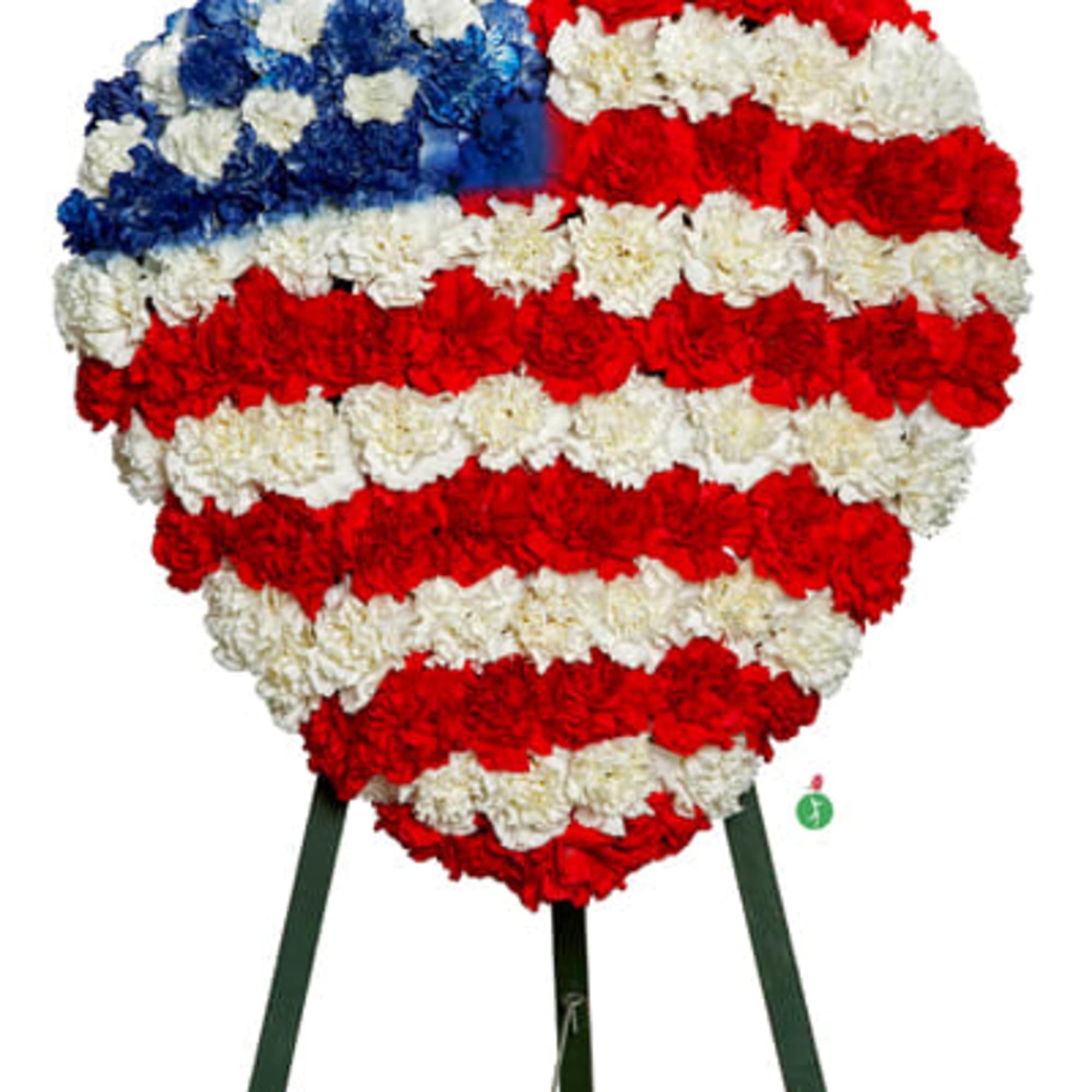 Red, white and blue carnations in the shape of a heart, symbolizing