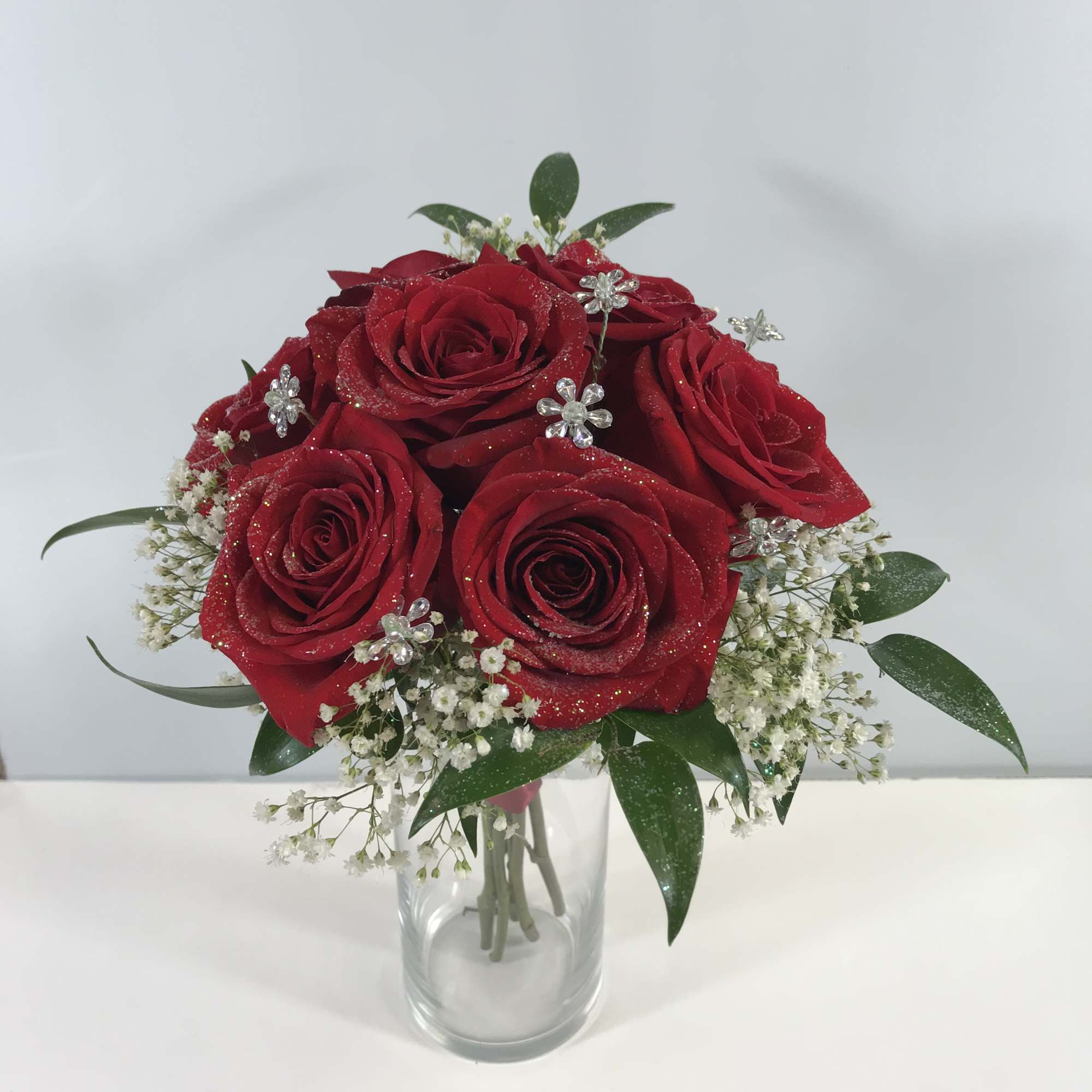 Medium sized prom clutch with white roses and sparkling blue bling.

Each prom