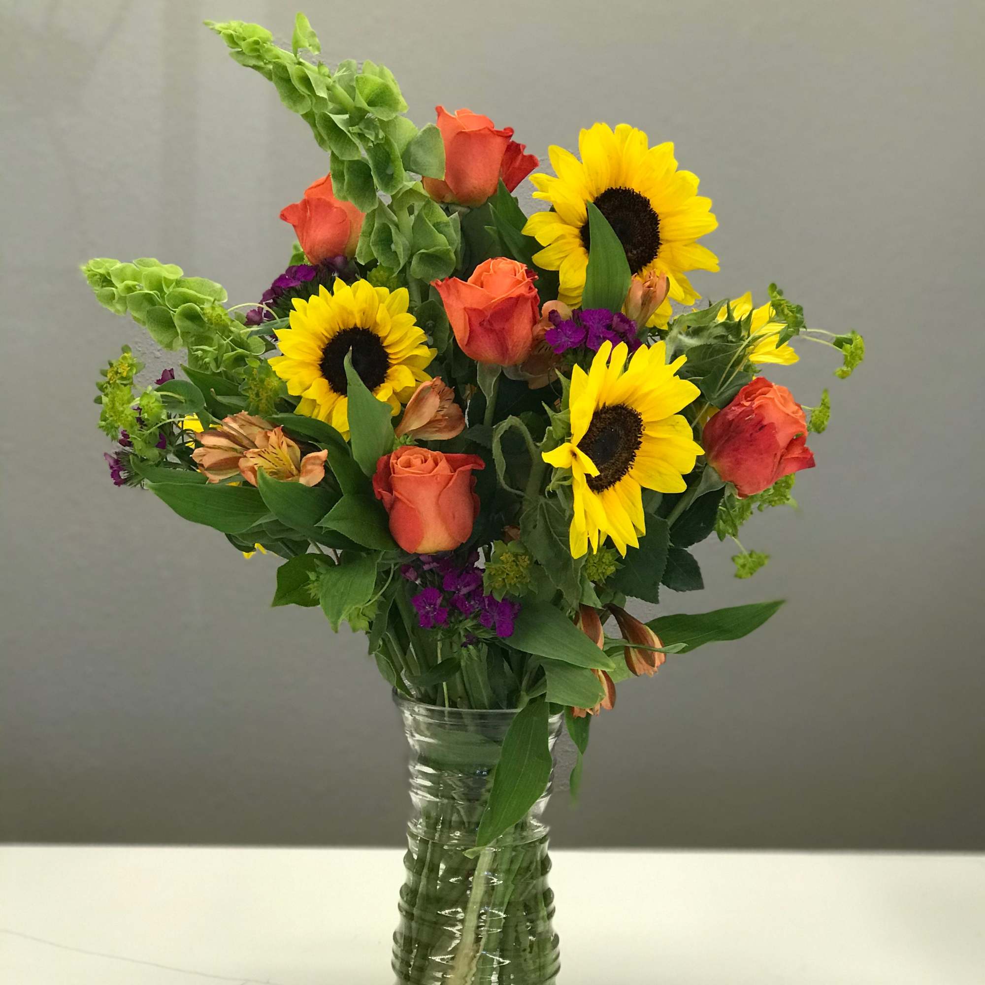 Brighten someone&#039;s day with pops of bright oranges, yellows, purples, and greens!