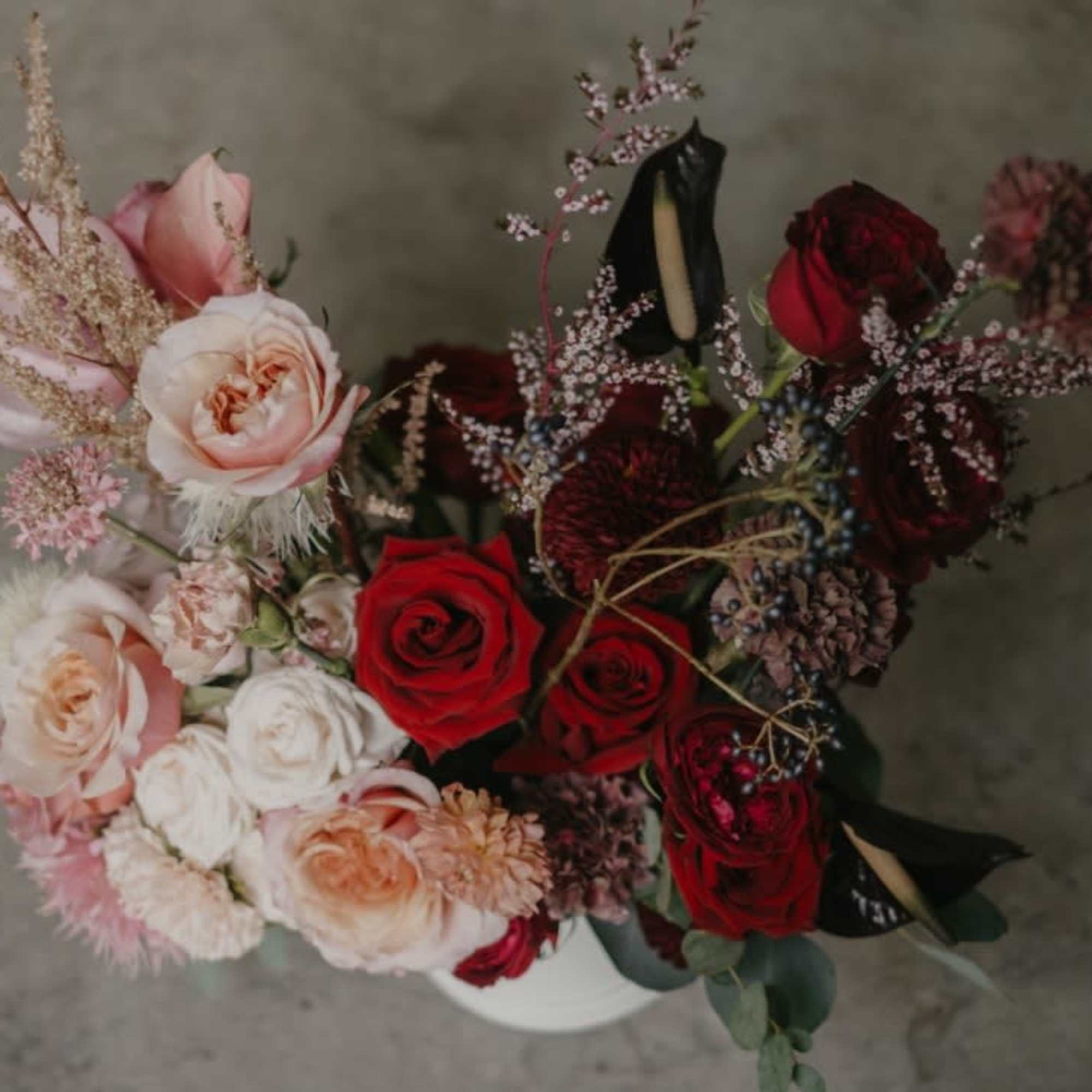 This incredible architectural arrangement combines a variety of blooms to create a