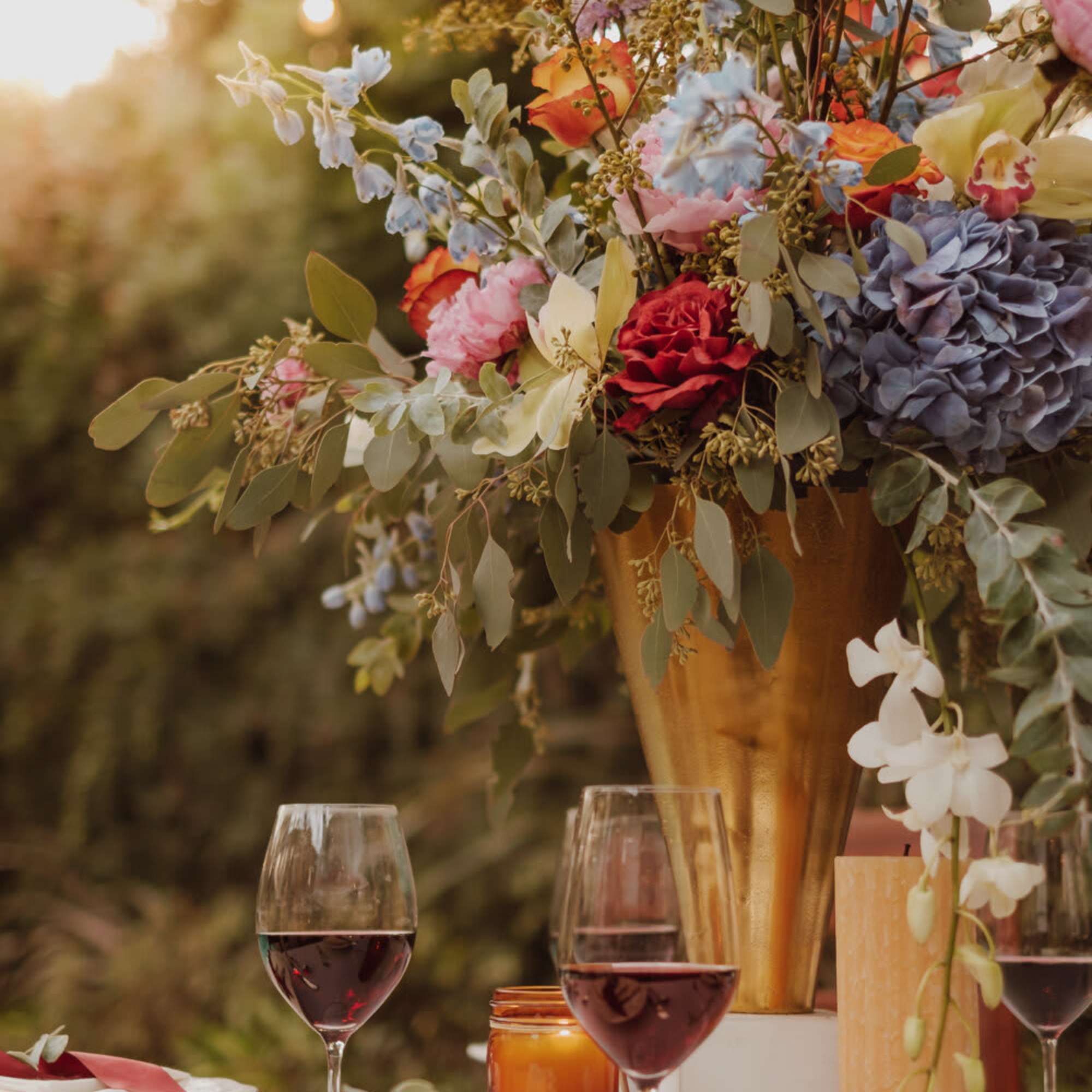 A classic draping floral centerpiece brings the whole table together, exuding timeless