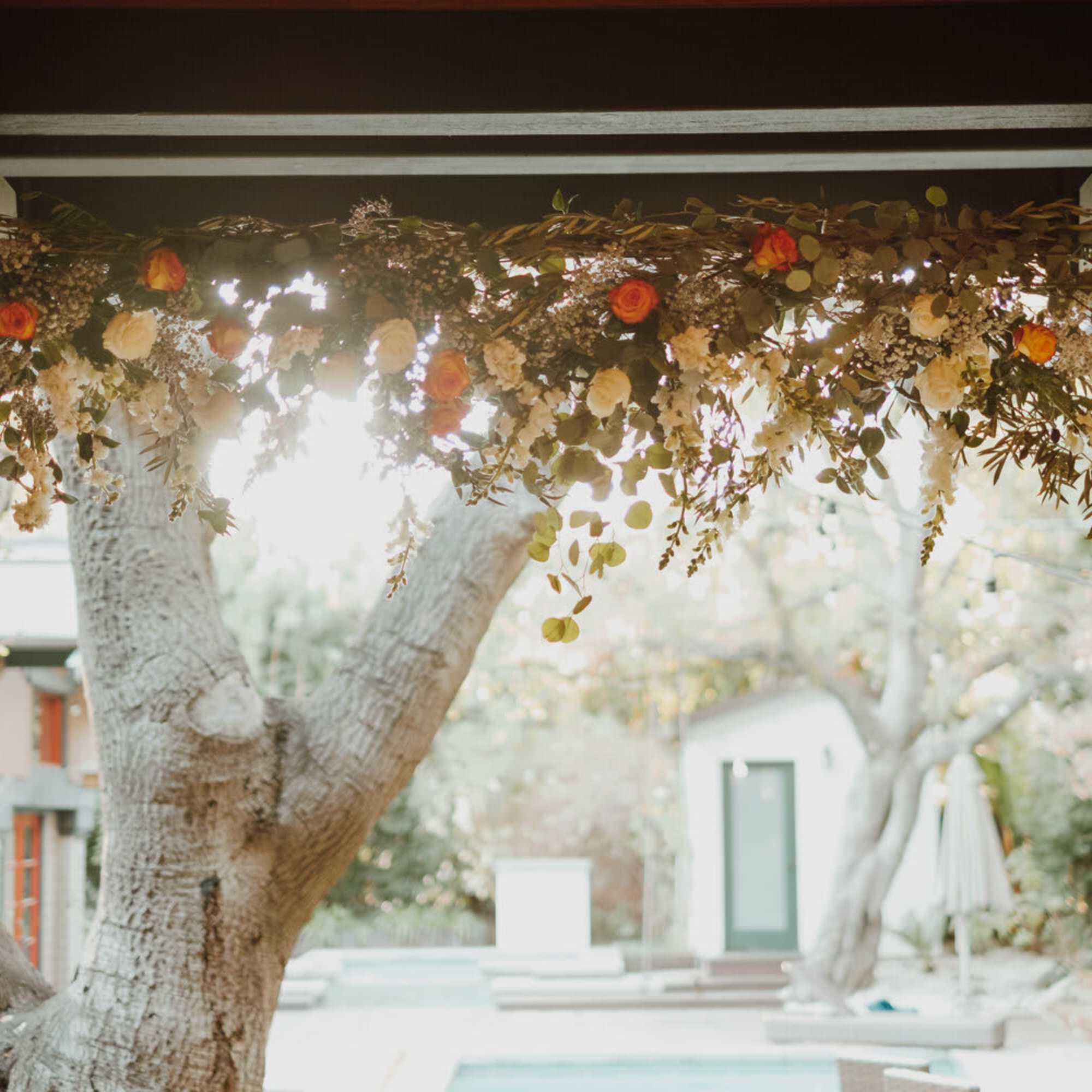 This hanging floral arrangement brings atmospheric beauty from overhead. The backdrop can