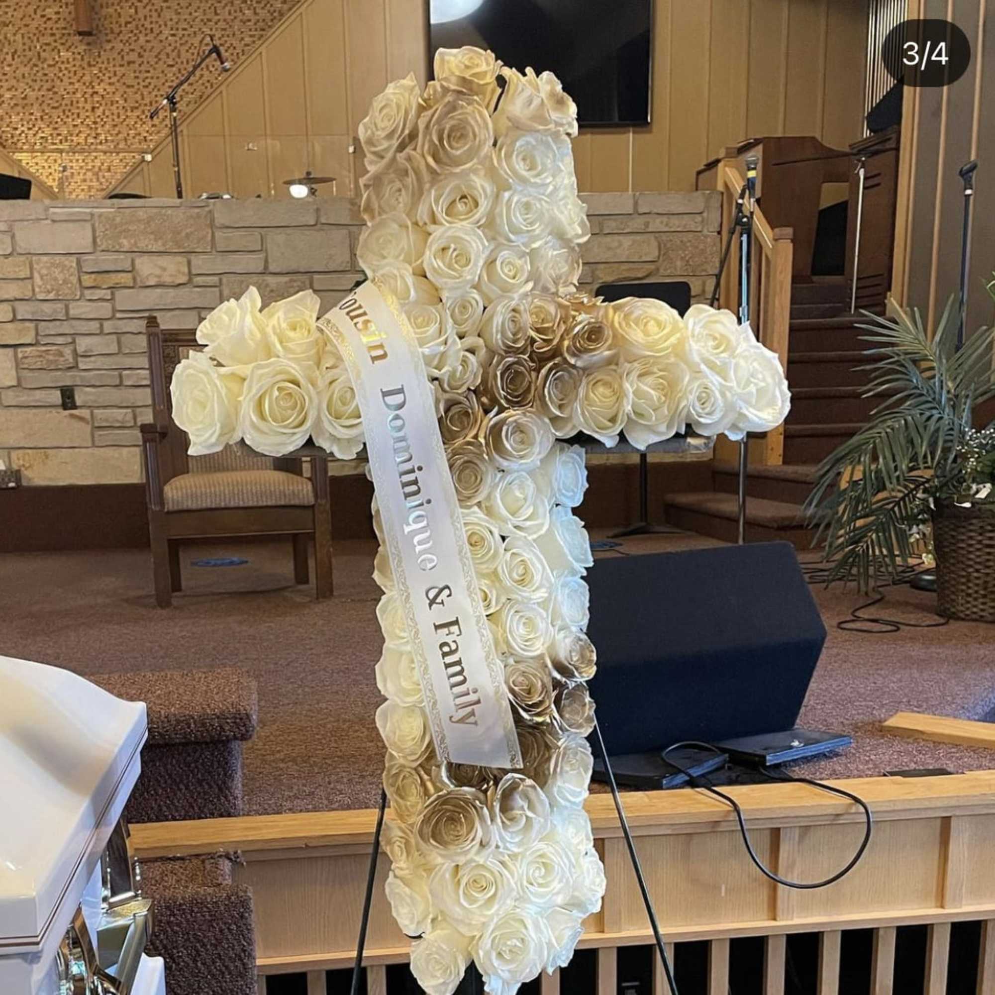 Twenty inch cross filled with roses