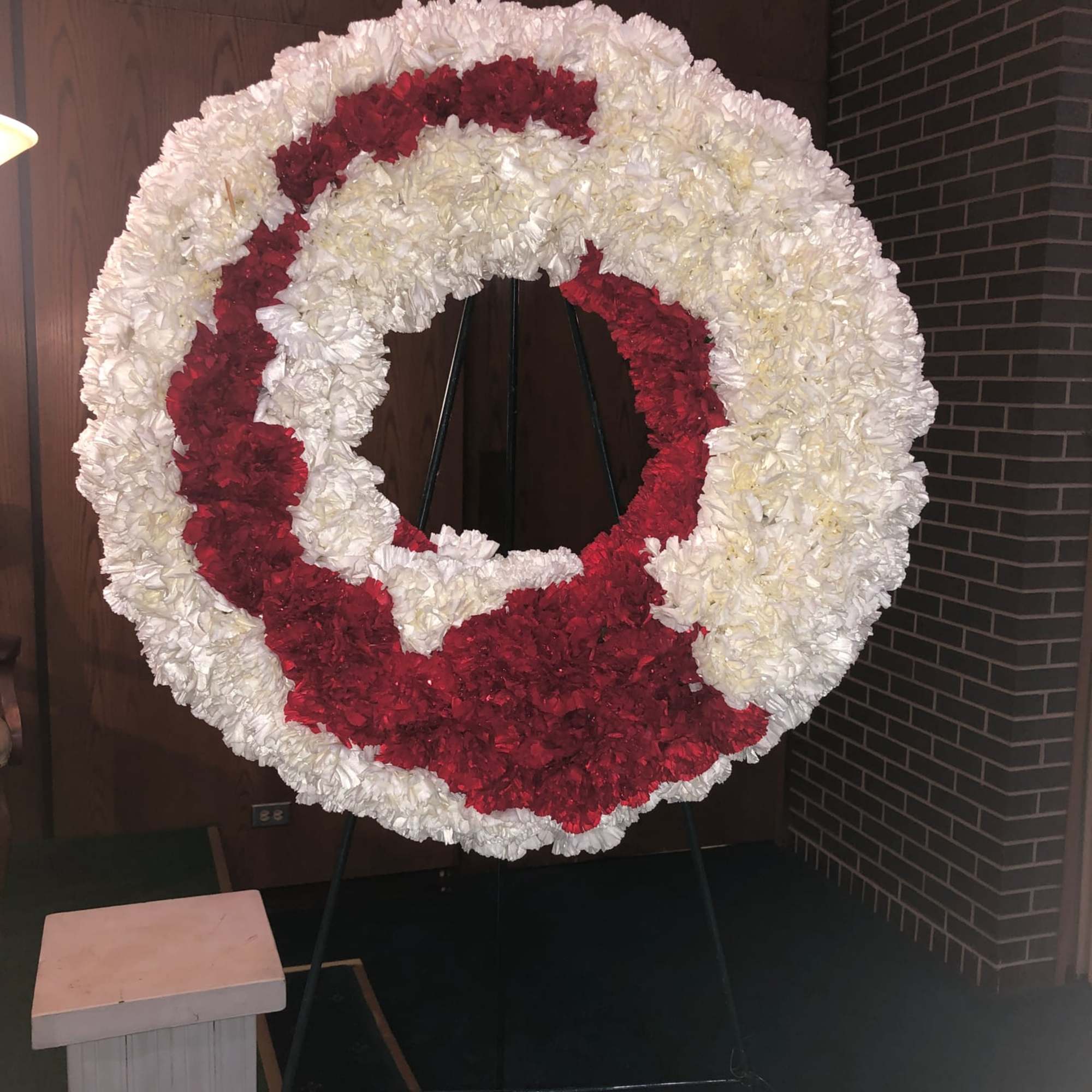 Twenty inch wreath filled with carnations