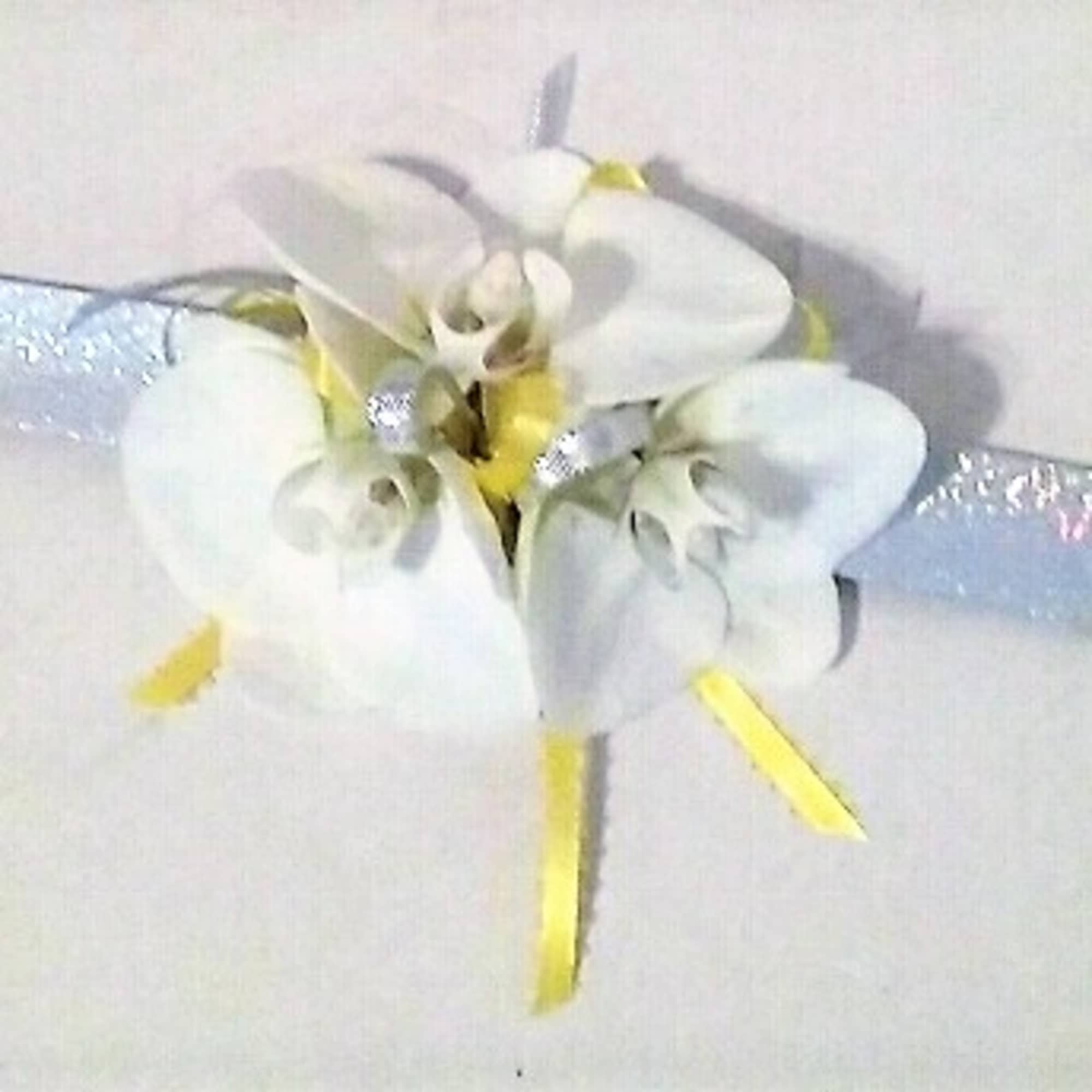 Corsages starting at $34.99.Other examples shown in weddings and prom gallery, click