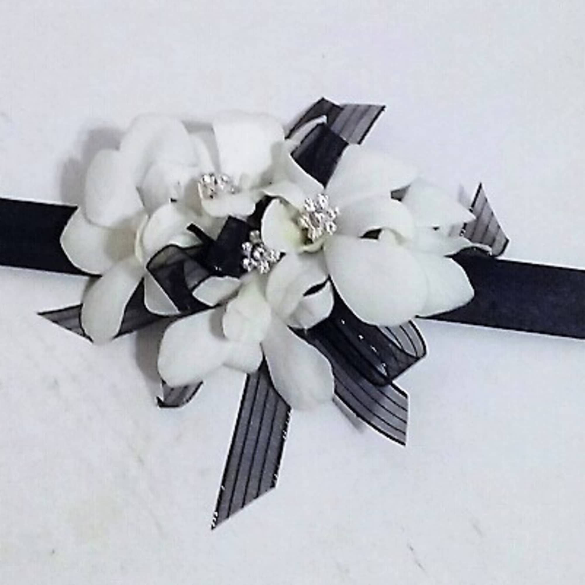 Corsages starting at $34.99.Other examples shown in weddings and prom gallery, click