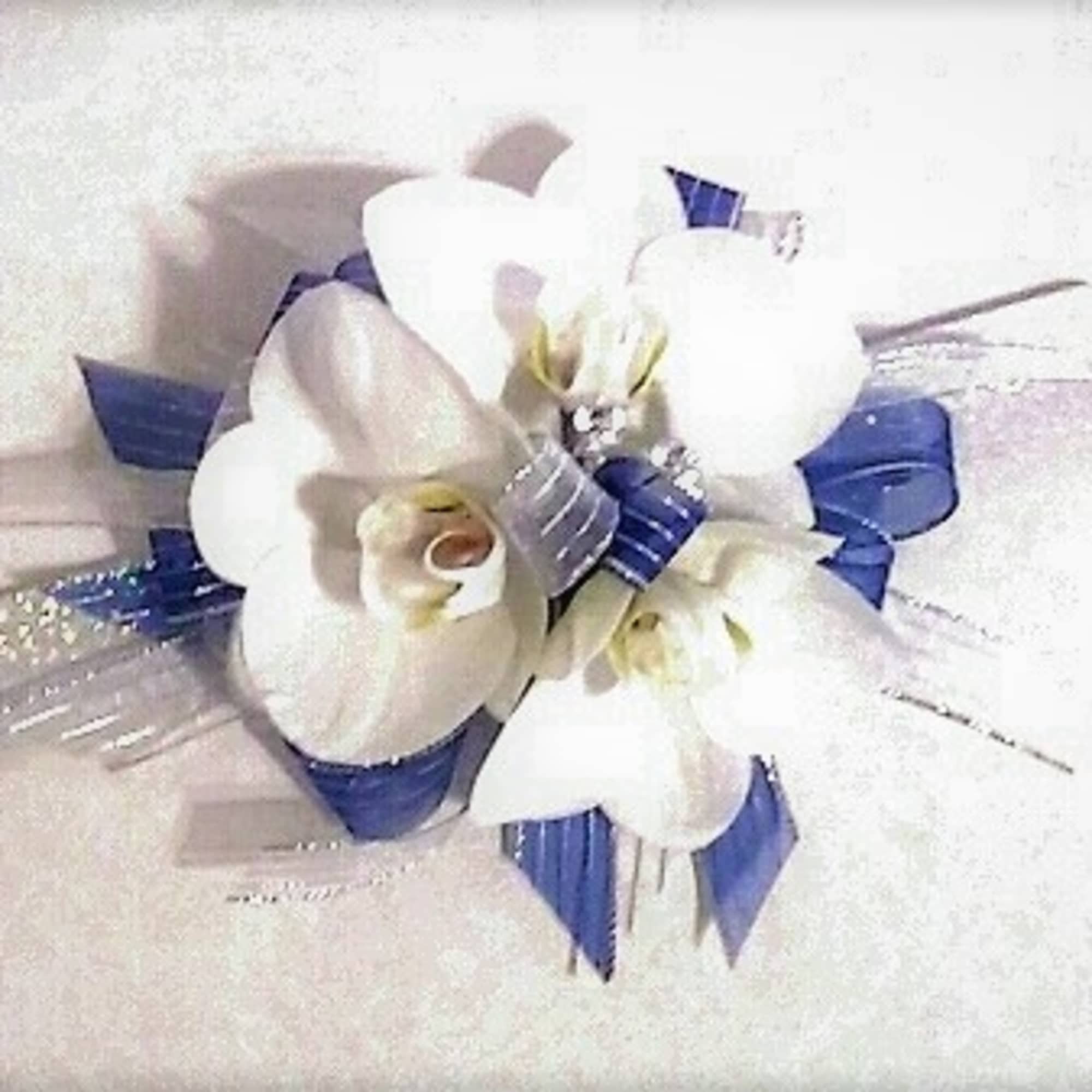 Corsages starting at $34.99.Other examples shown in weddings and prom gallery, click