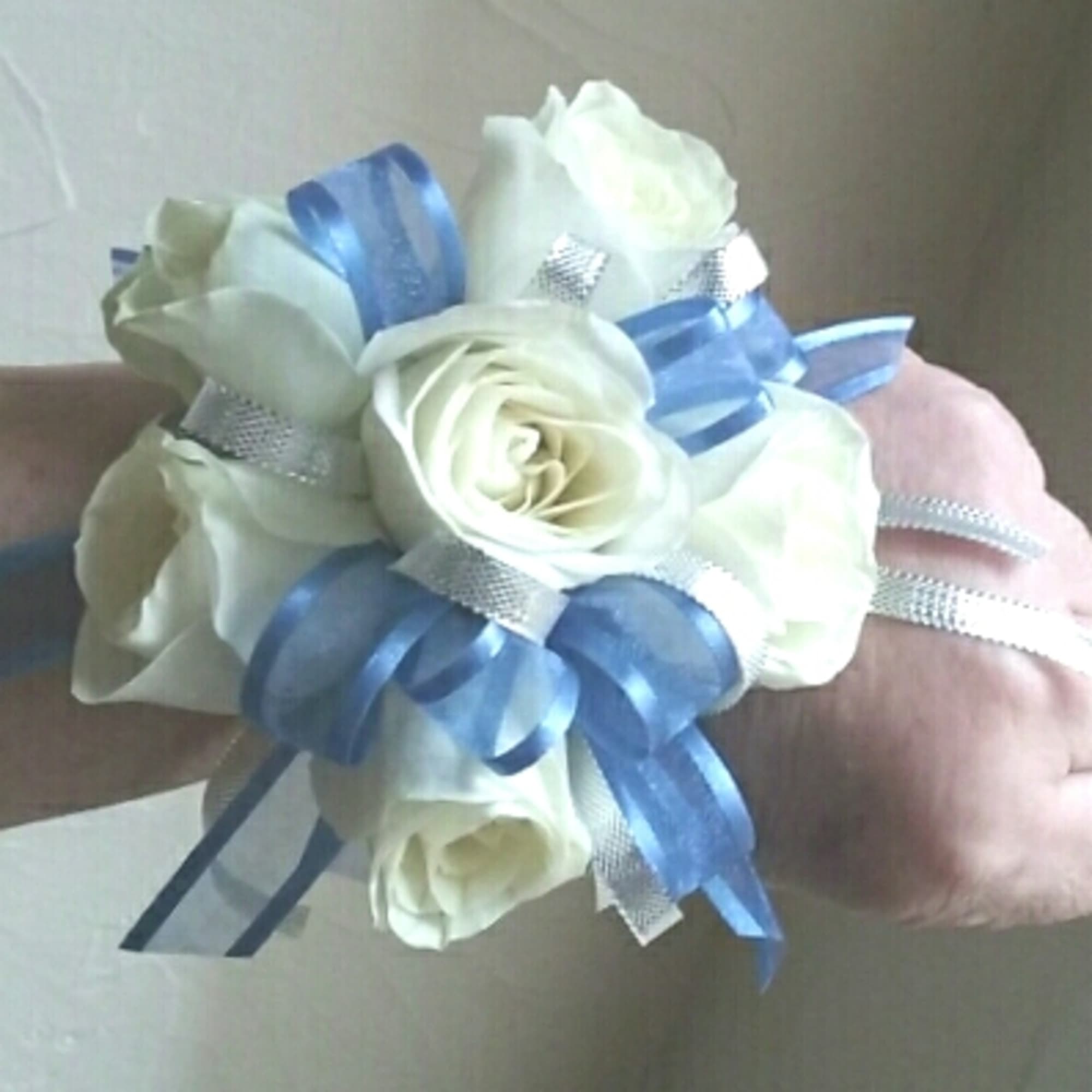 Corsages starting at $34.99.Other examples shown in weddings and prom gallery, click