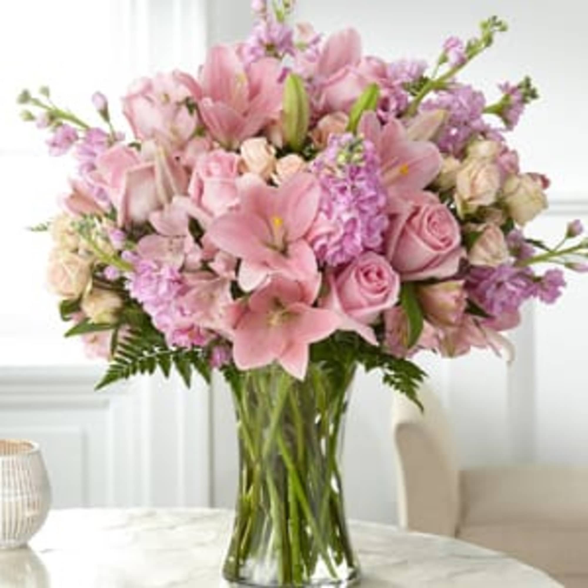 An array of blushing pink blooms come together beautifully to express your