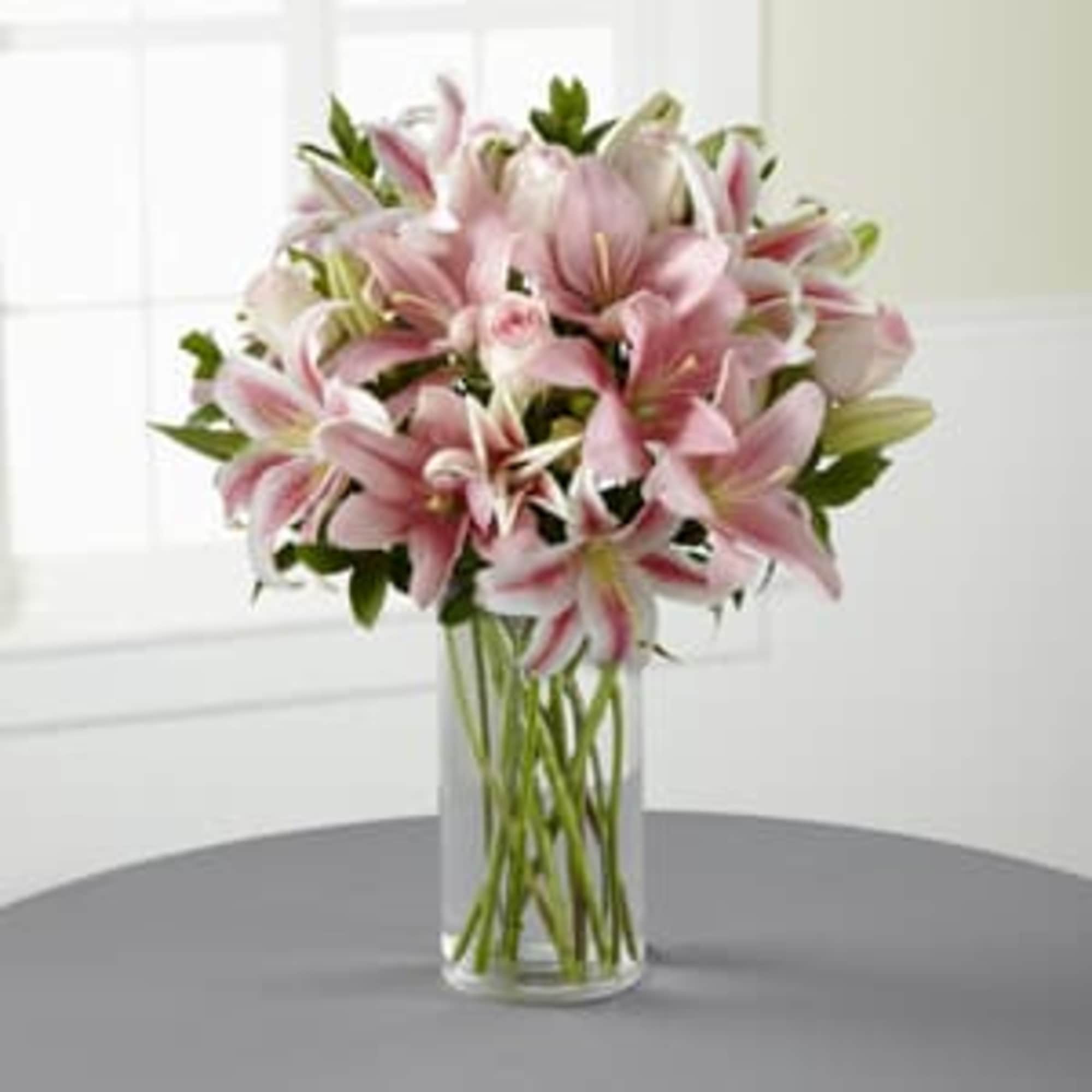 Like a lovely floral &ldquo;hug,&rdquo; this blushing bouquet delivers your sincerest condolences