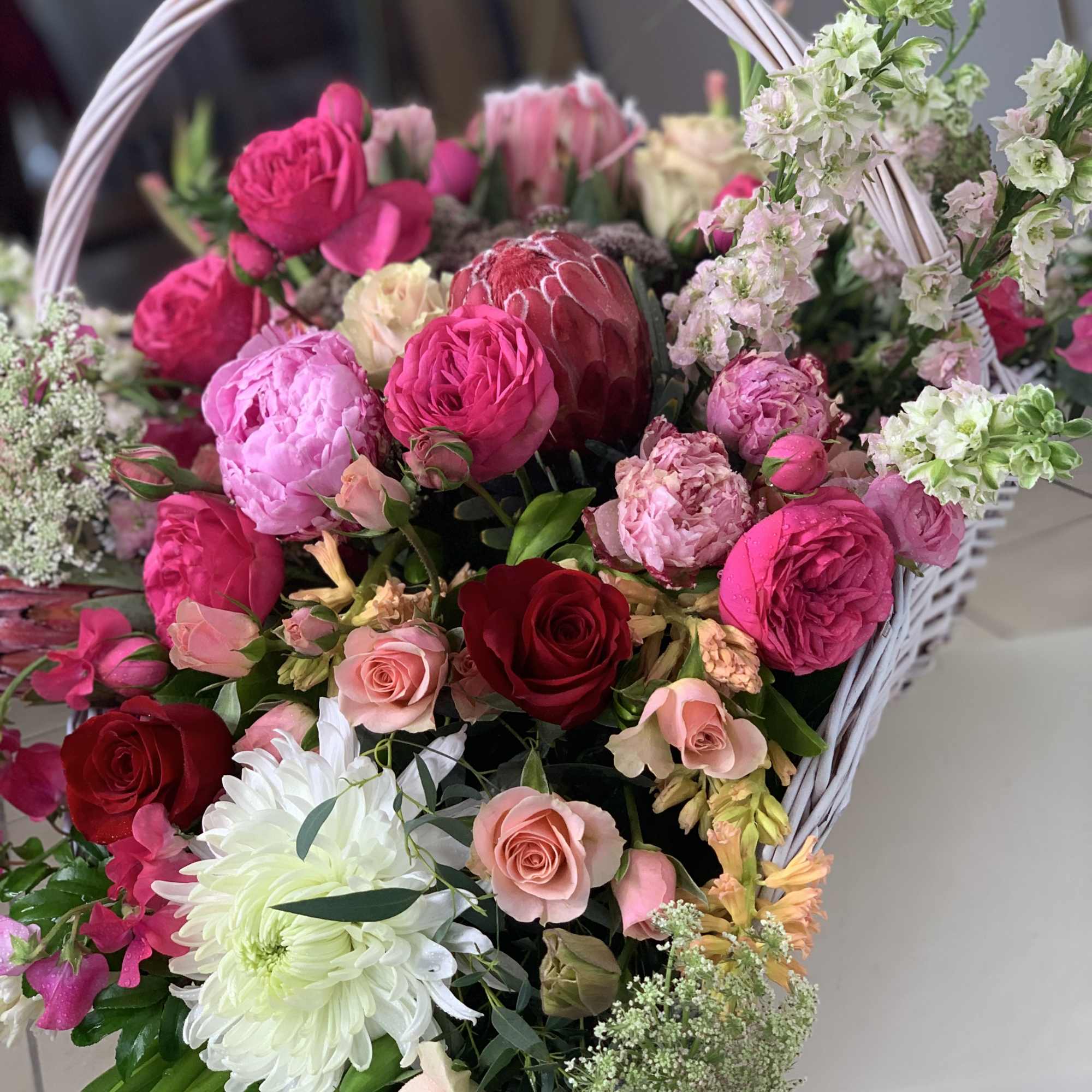 Luxury freshest blooms arranged in a large basket.