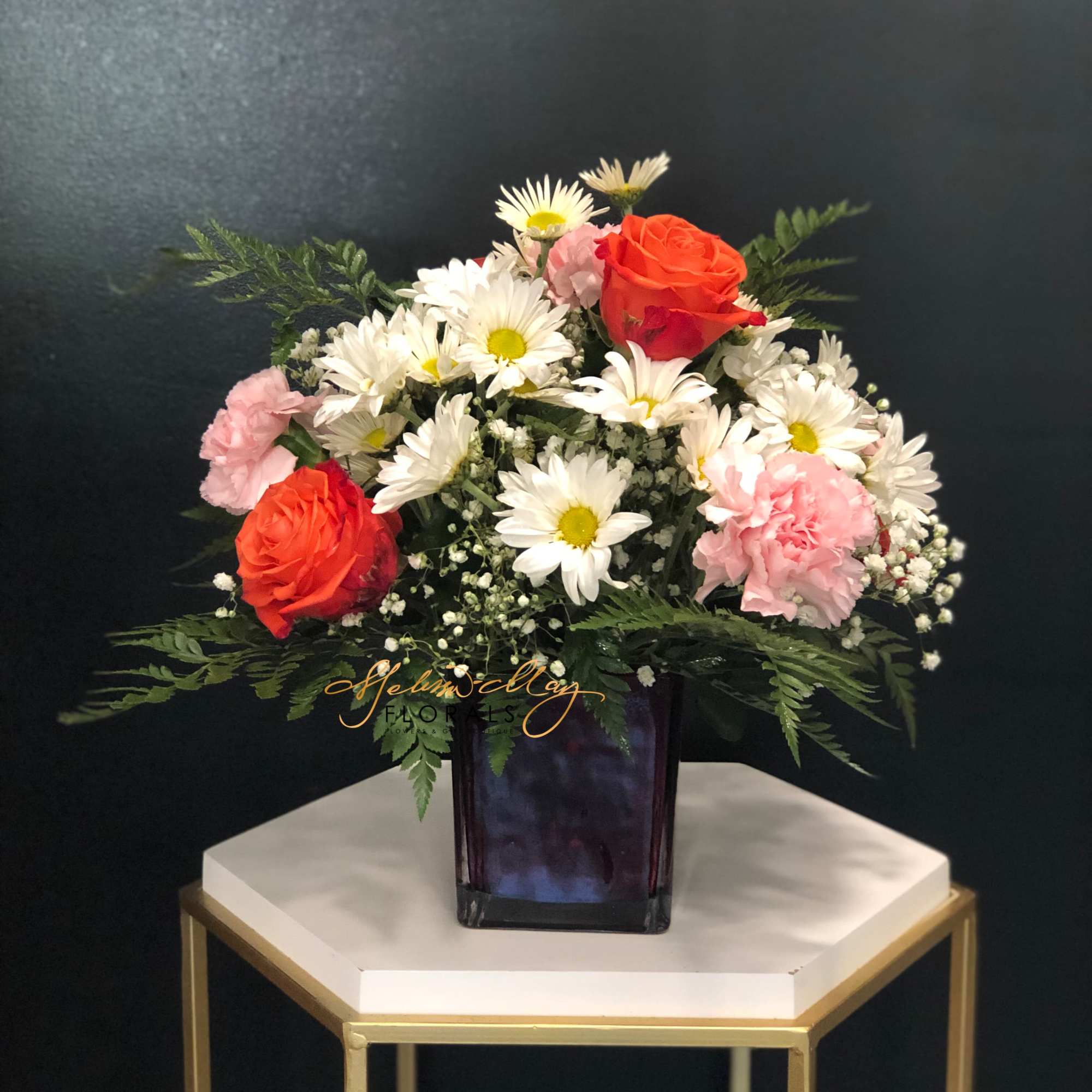 Take an enchanted walk in the forest with this gorgeous woodland-inspired arrangement.