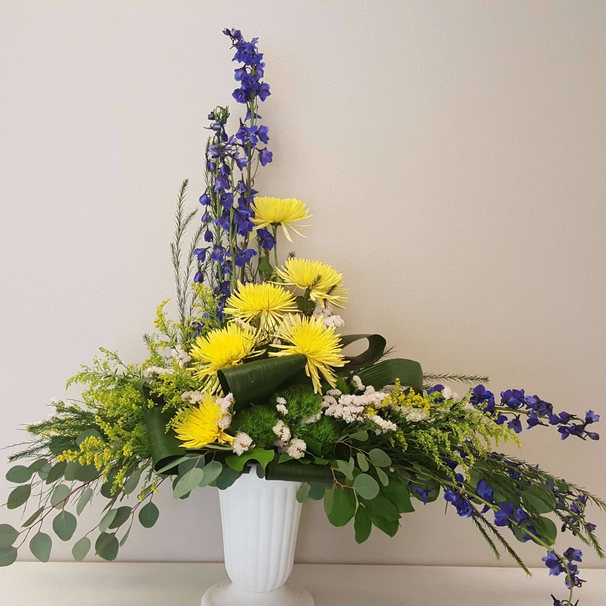 Send a beautiful funeral arrangement to honor a legacy, with the colors