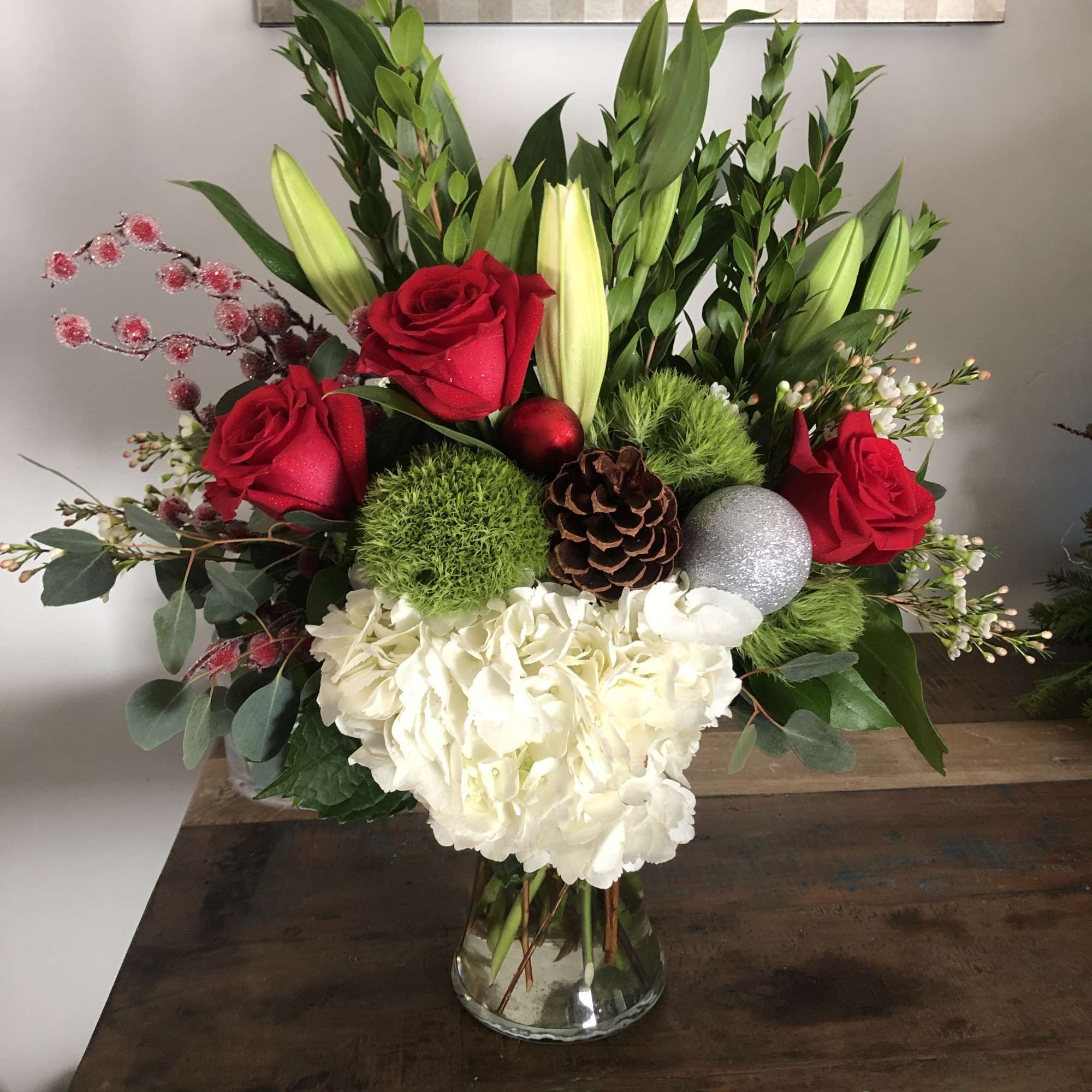 Hydrangea, red roses, evergreen and green ball dianthus and lilies  Hydrangea, red roses, evergreen and green ball dianthus and lilies