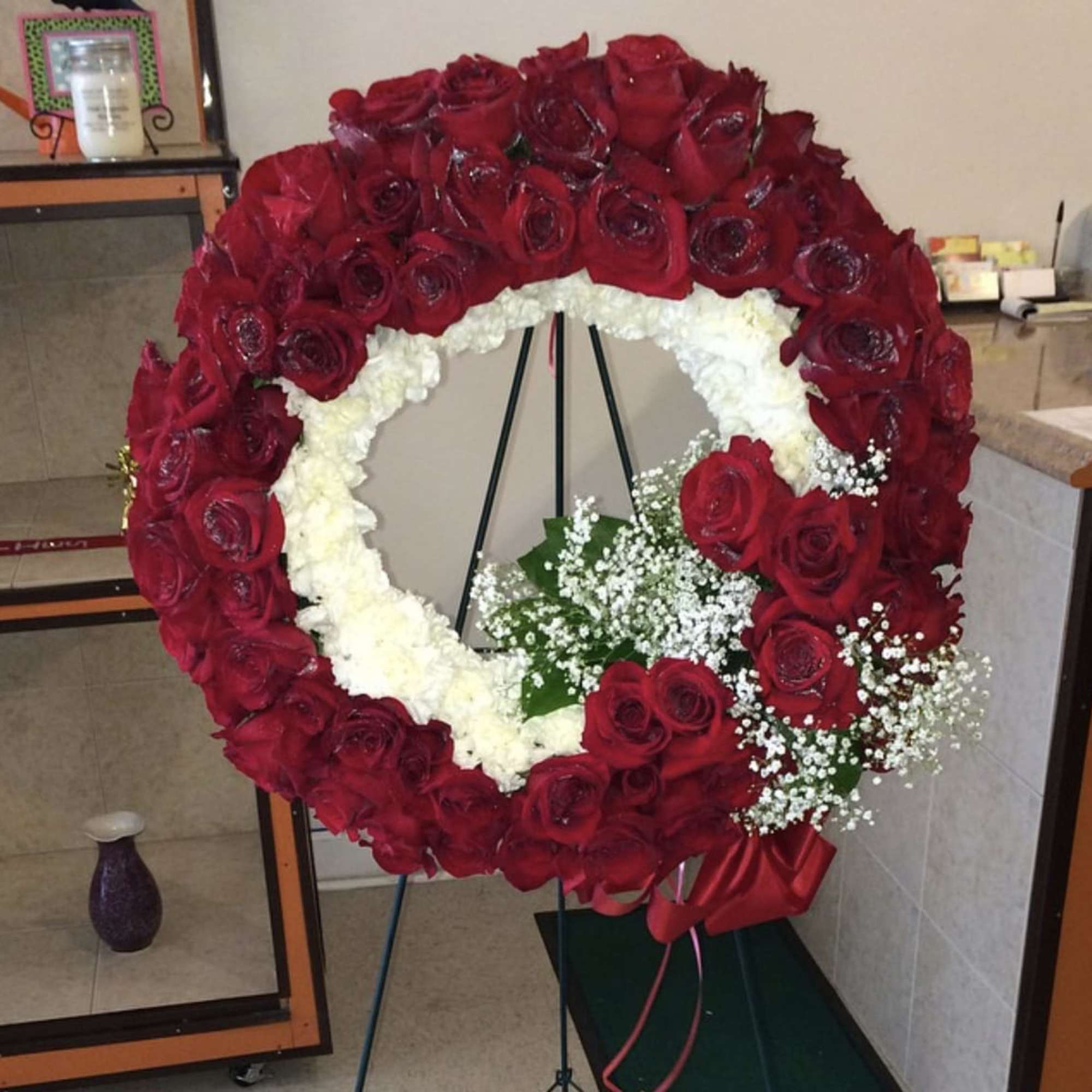 Twenty inch wreath filled with roses and carnations