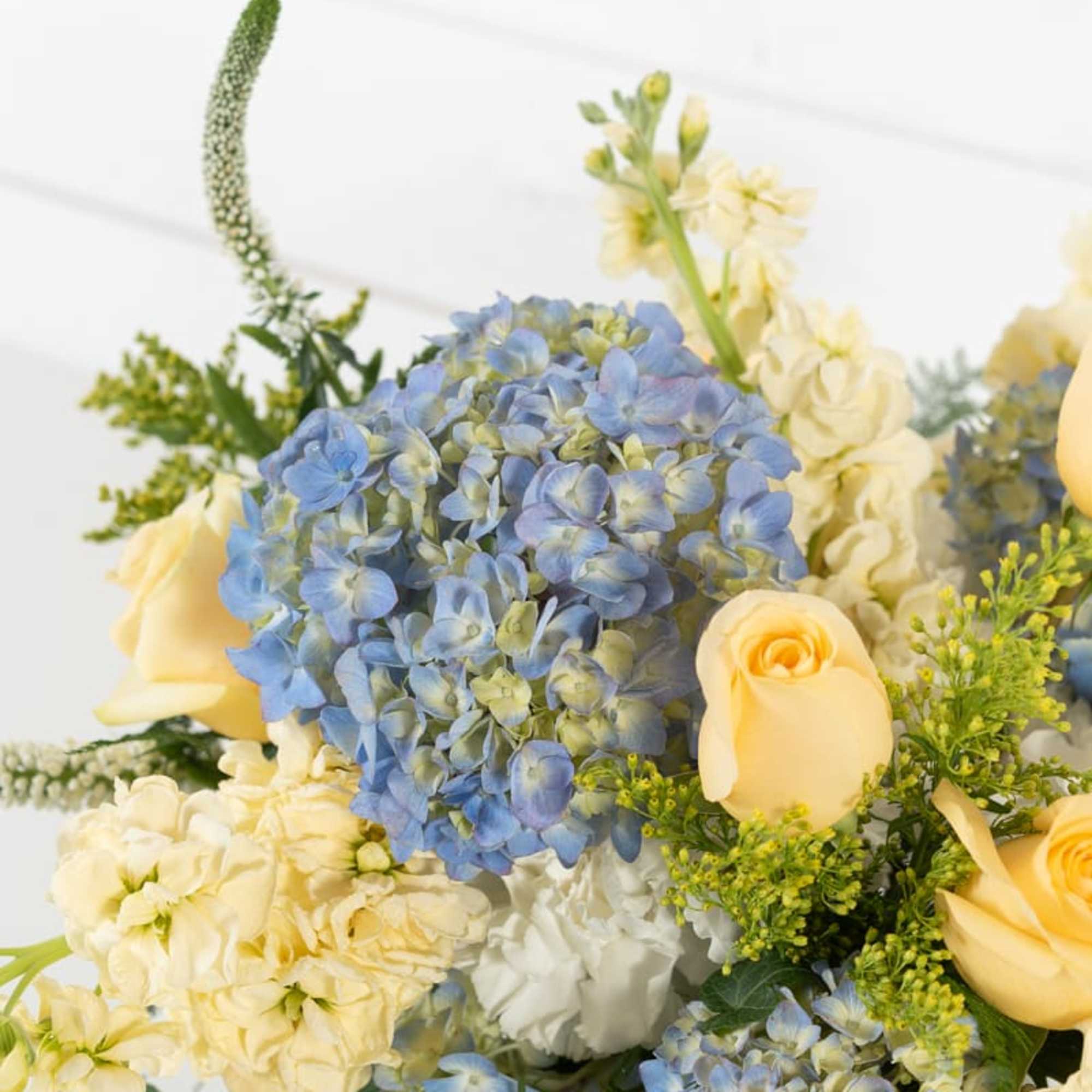 Simple reminders of summertime in the south... Lush blue hydrangeas with roses