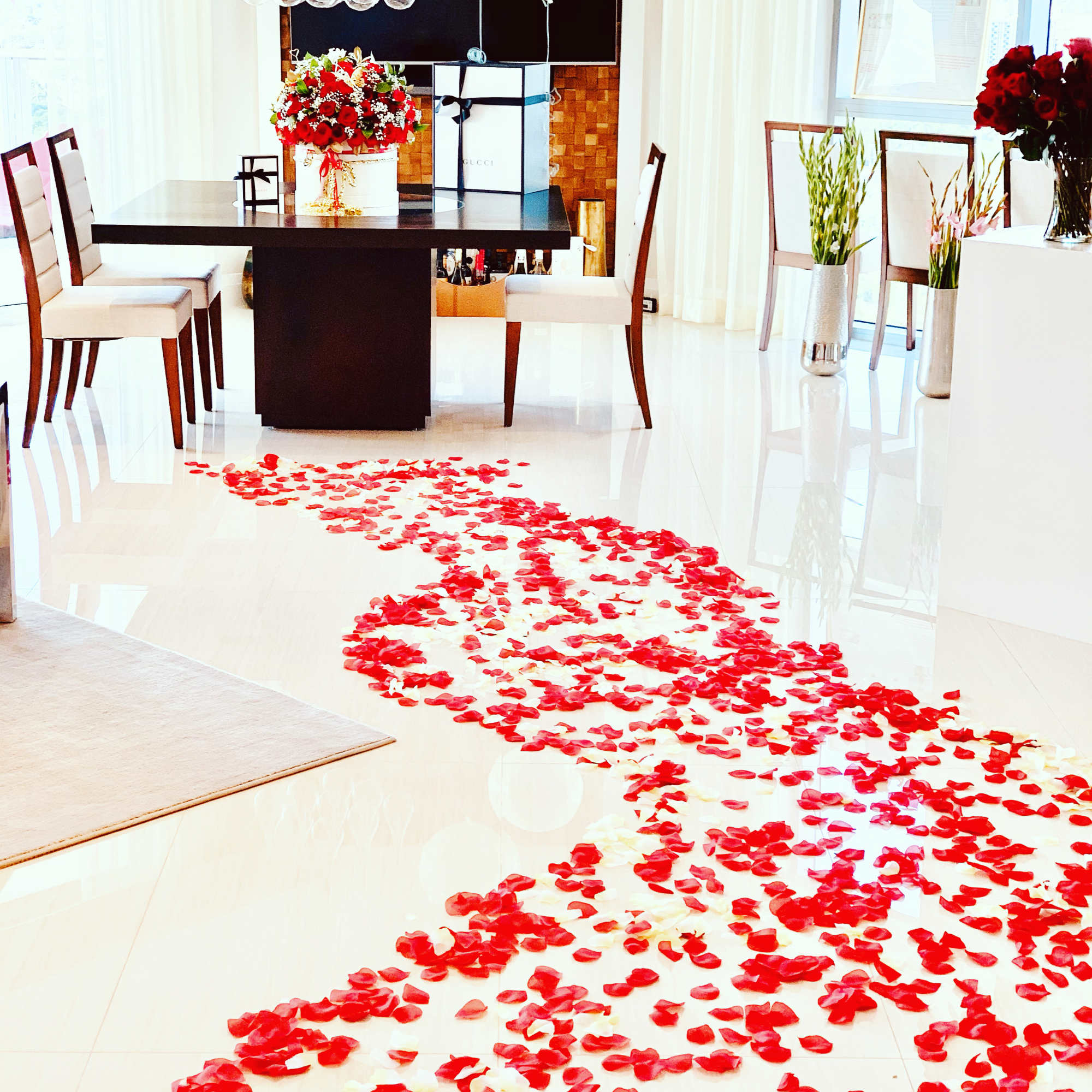 extra size velvet box with 100 fresh roses with small flower added.