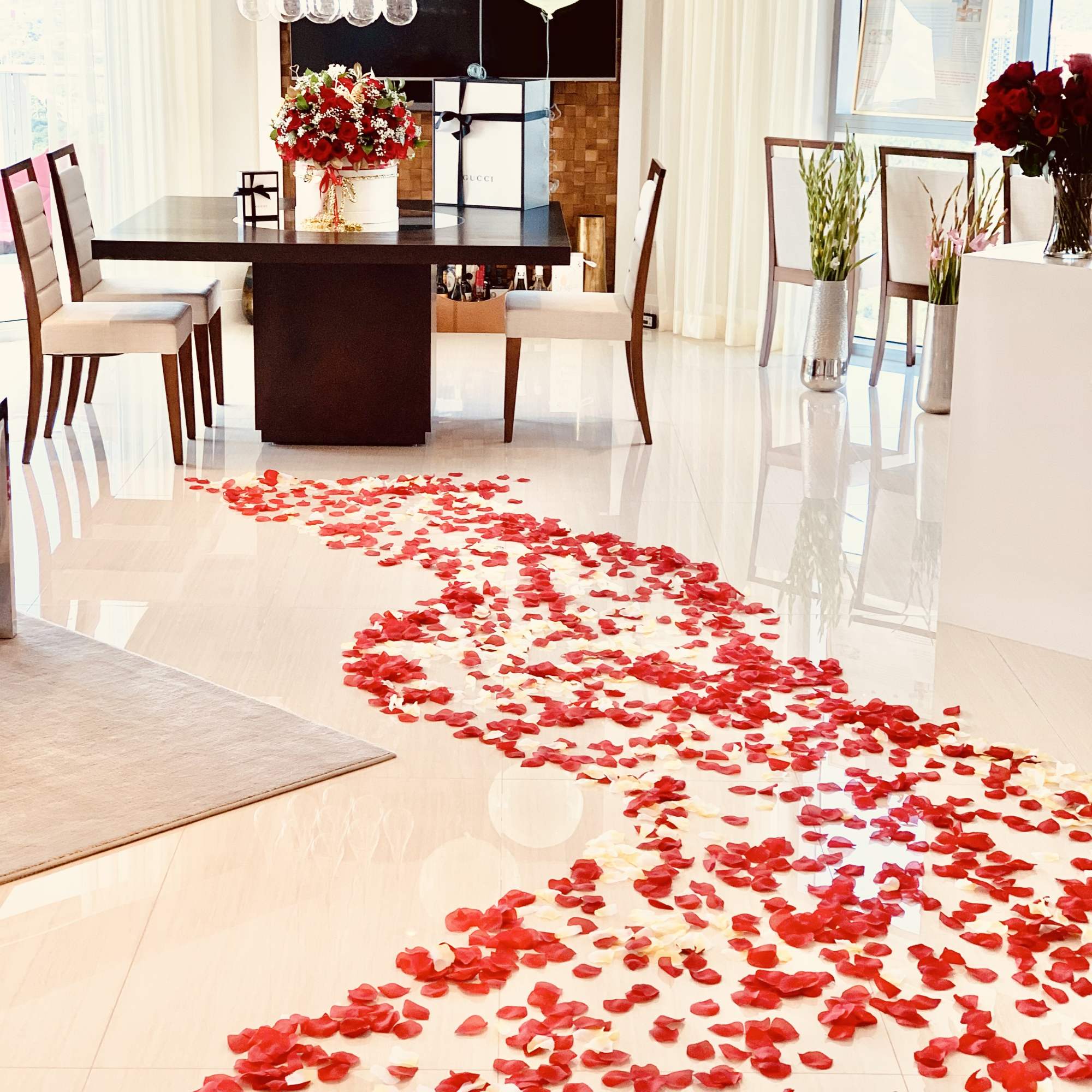 extra size velvet box with 100 fresh roses with small flower added.