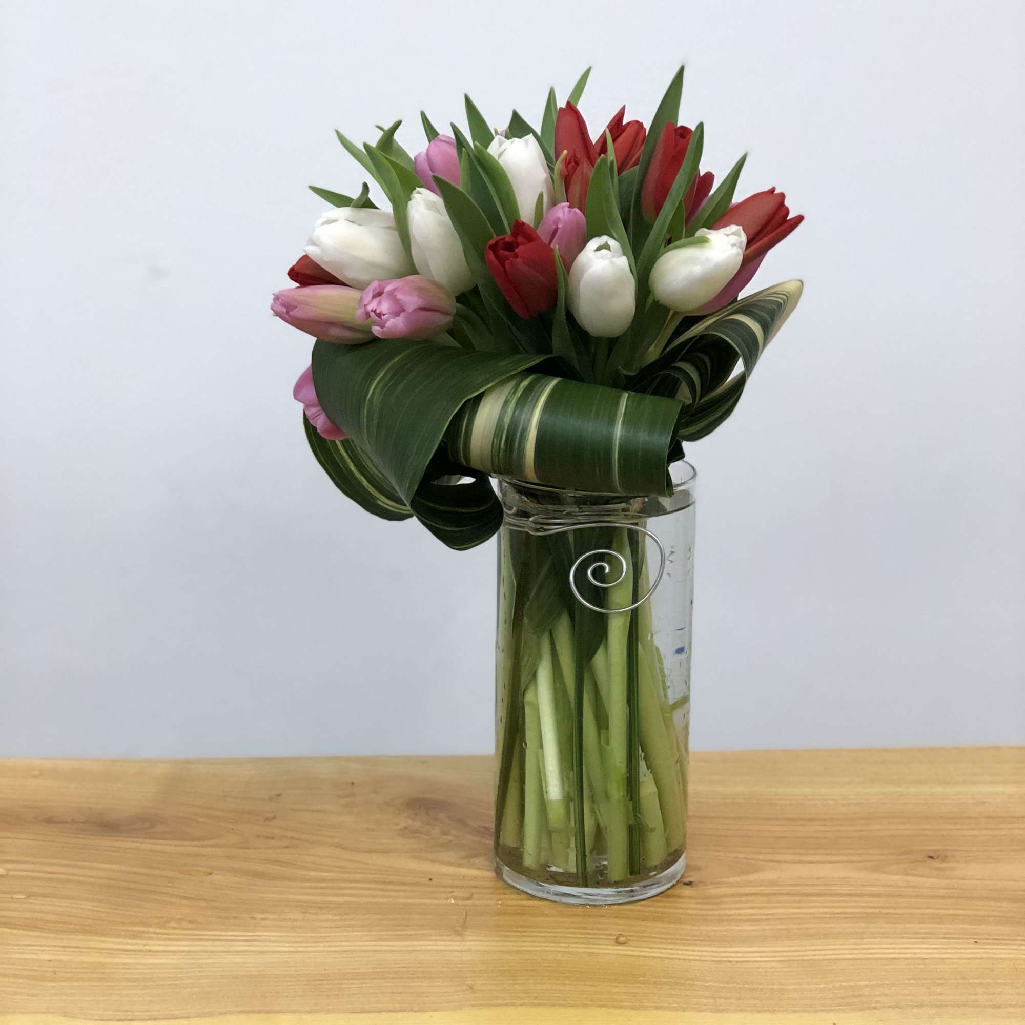 Tulips are placed in a beautiful, elegant and unique way. 

If no