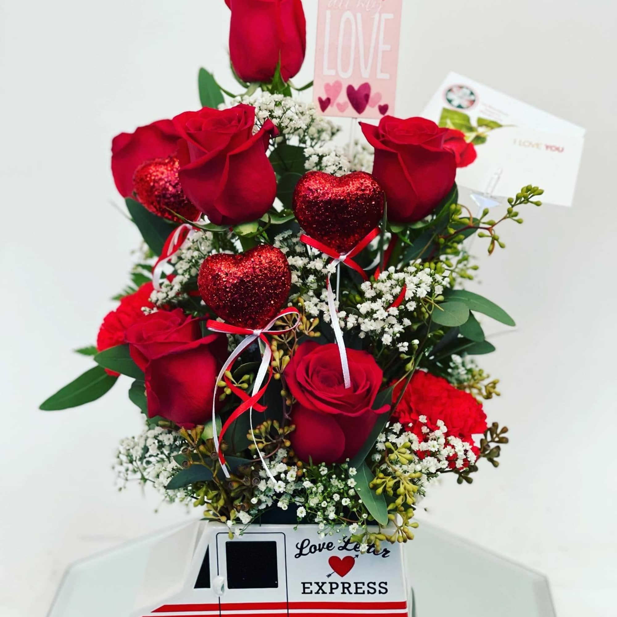 In a cute mail man vase  In a cute mail man vase