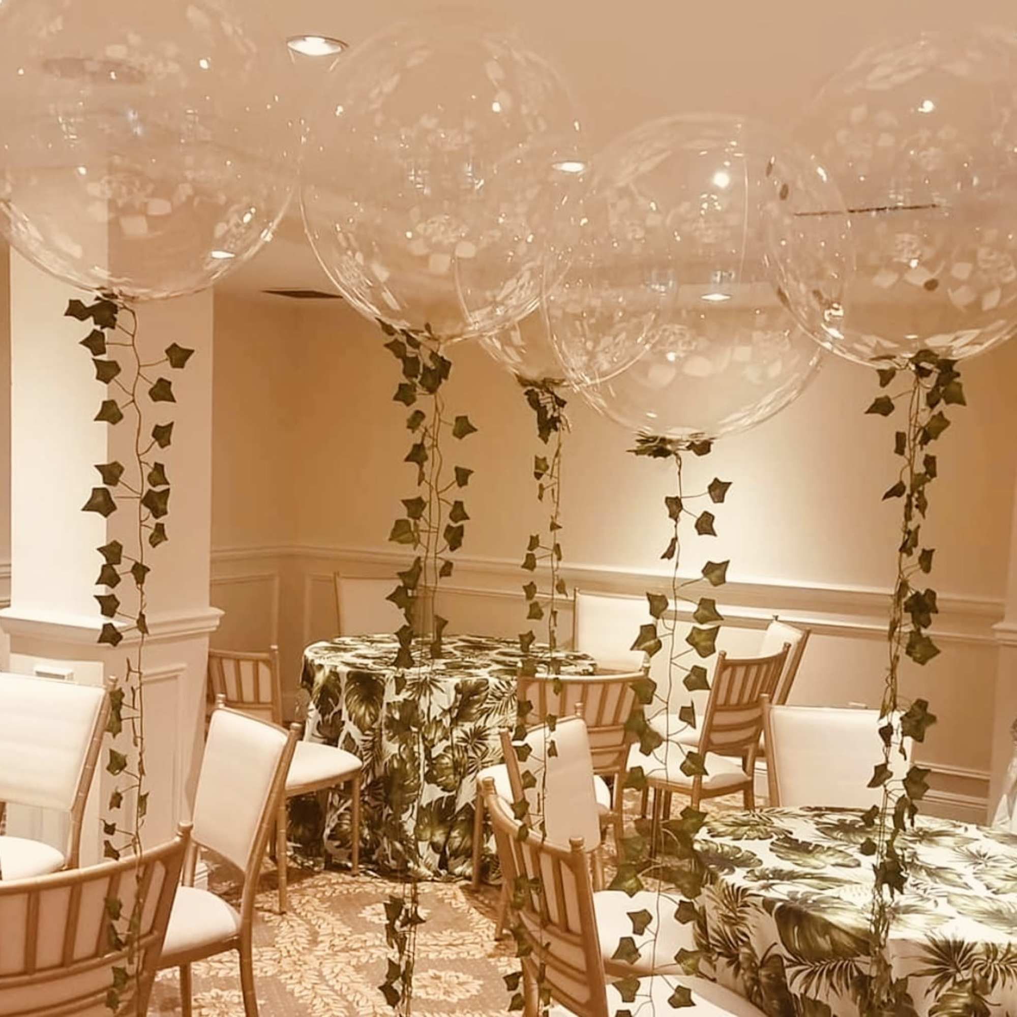 Organic bubble balloon of 18 inch inflated with helium. Gold round confetti