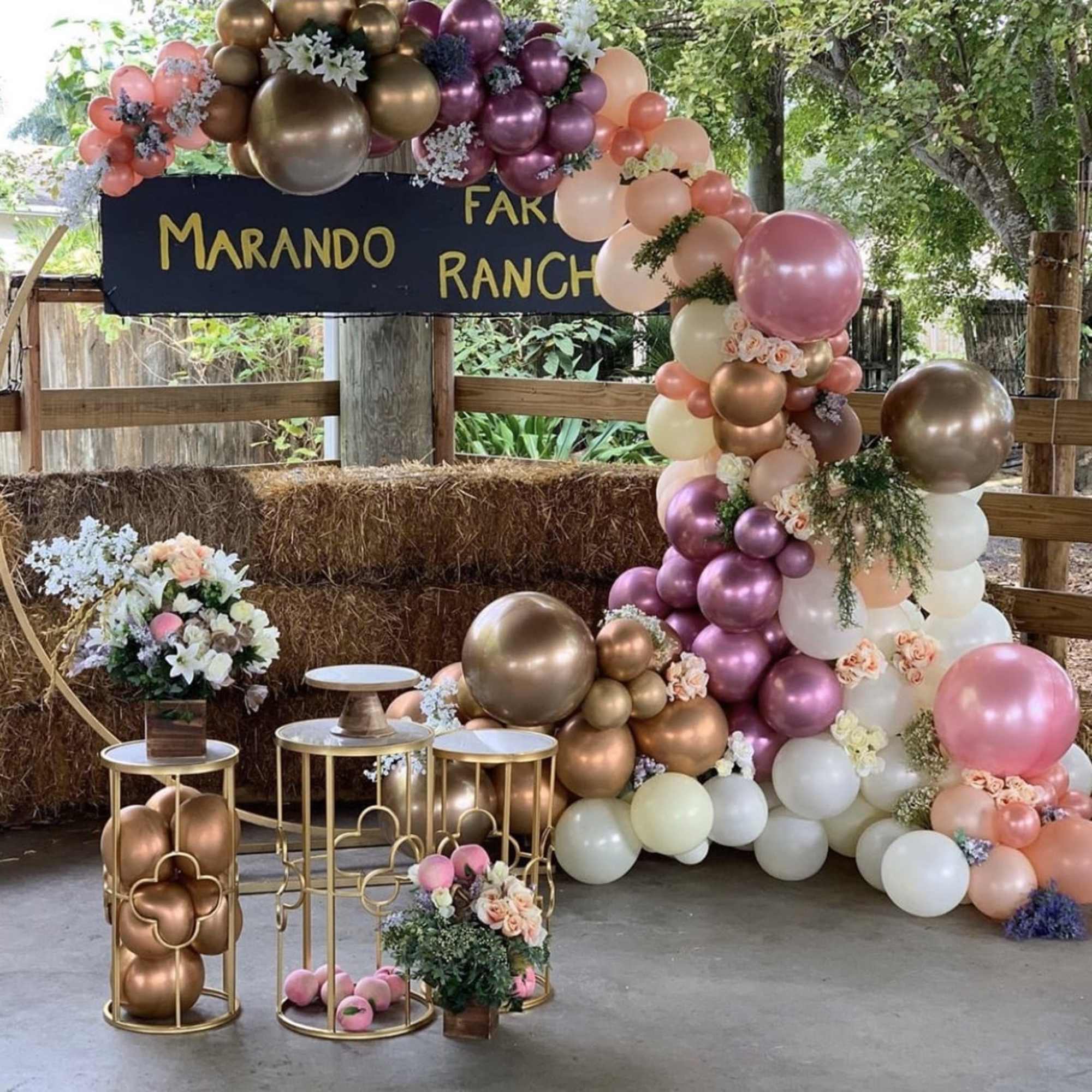 This package includes a circular arch rental, circular balloon garland, 3 desert