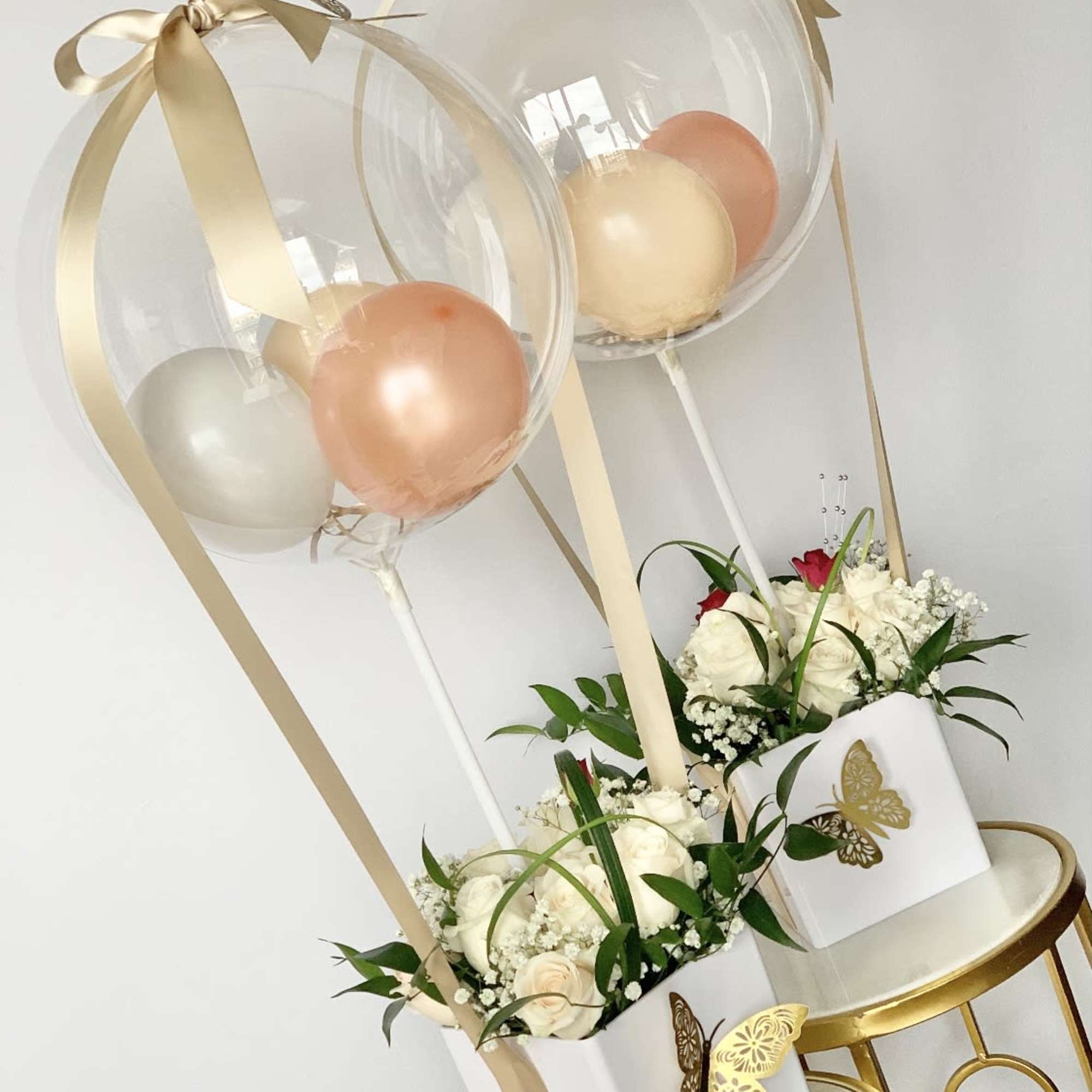 Two balloon-flower arrangements as a package deal. Will be delivered approximately as