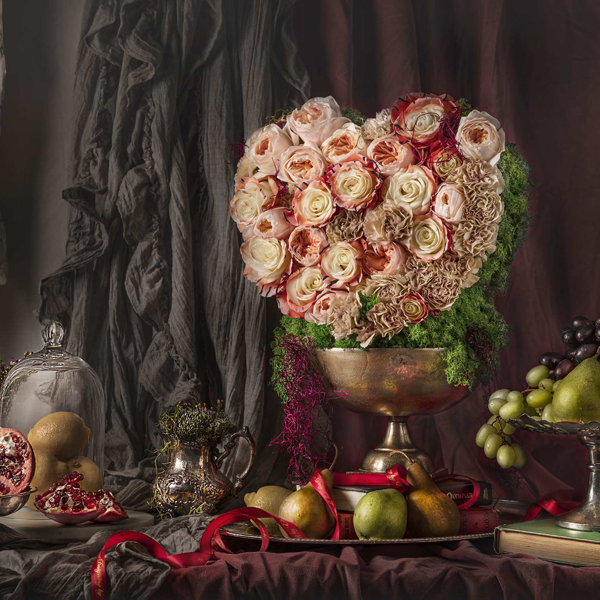 A fresh flower heart placed in a bronze type vase and decorated