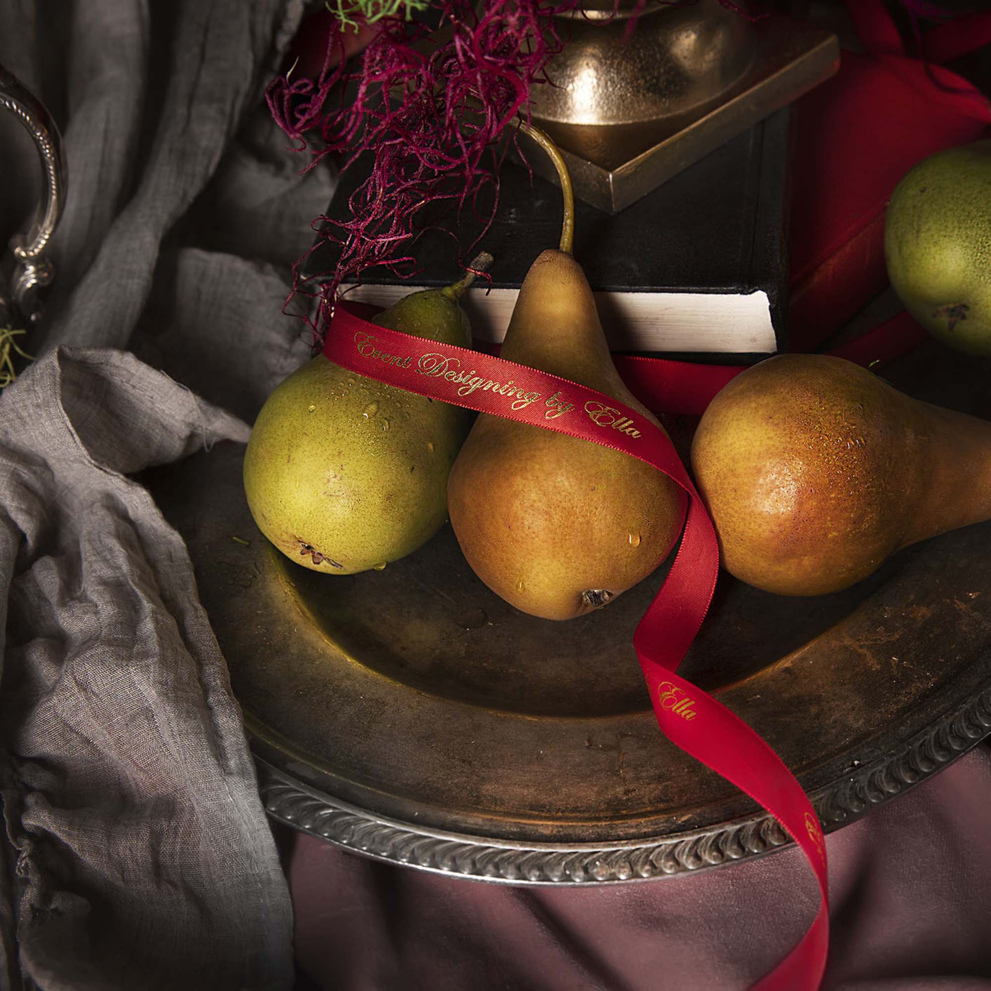 A fresh flower heart placed in a bronze type vase and decorated