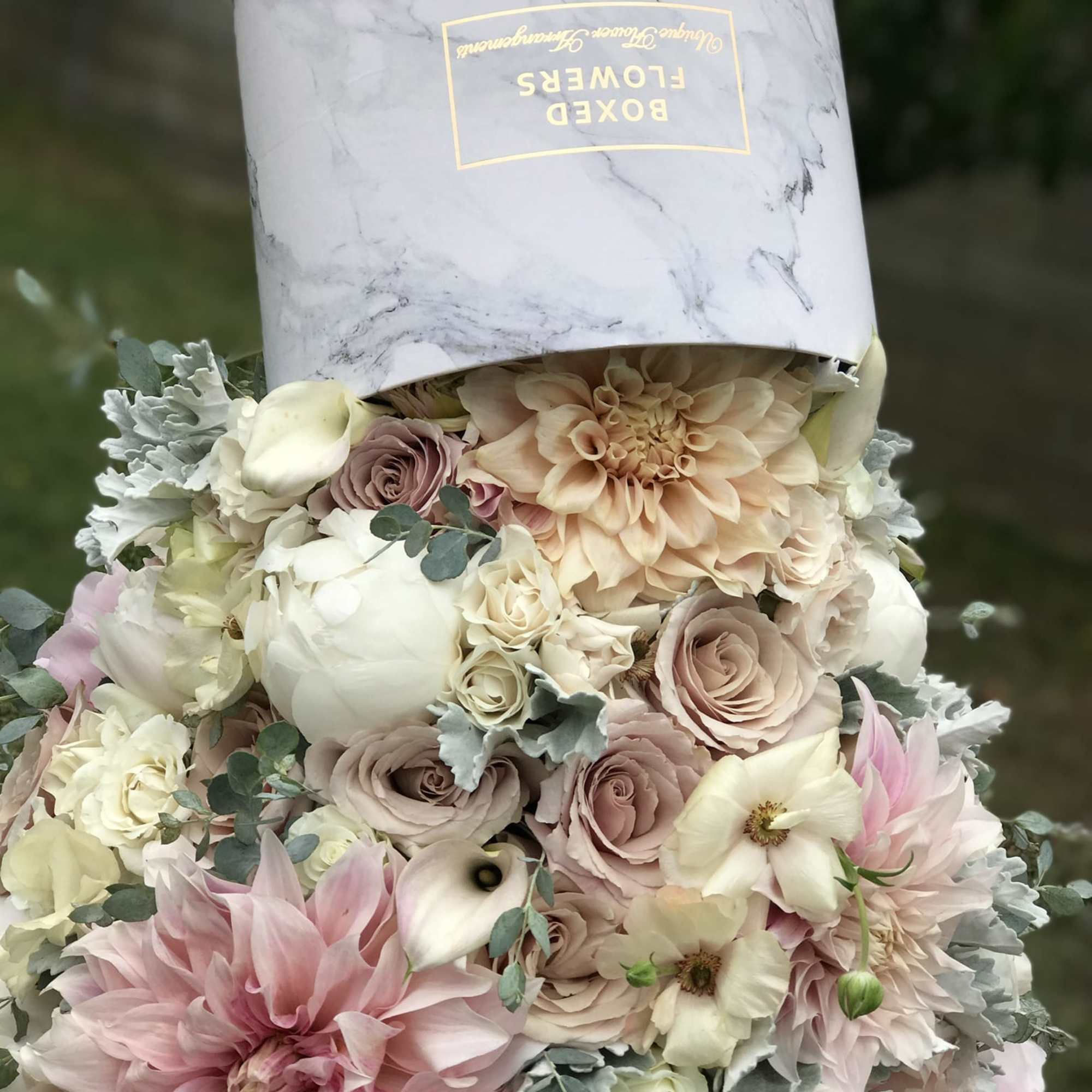 A unique arrangement inspired by a waterfall. Flowers falling down of an A unique arrangement inspired by a waterfall. Flowers falling down of an