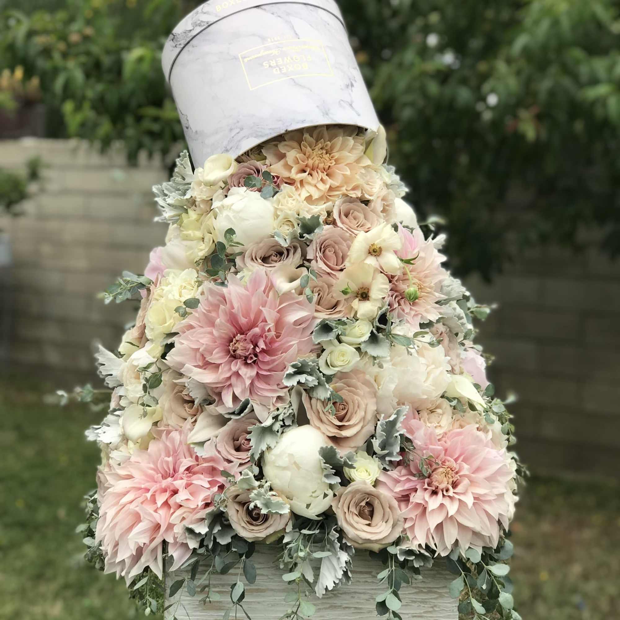 A unique arrangement inspired by a waterfall. Flowers falling down of an A unique arrangement inspired by a waterfall. Flowers falling down of an