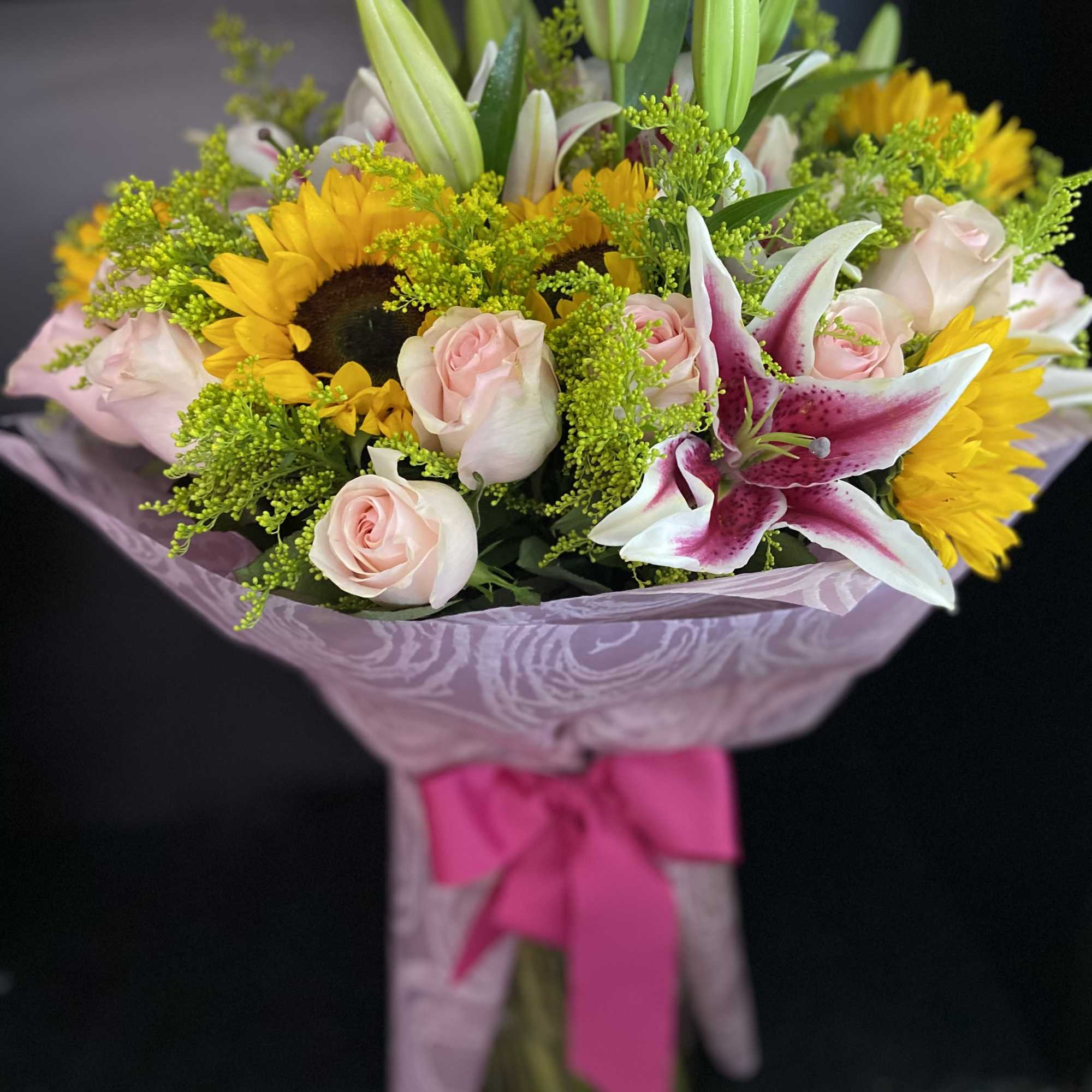 24 Pink Roses, 5 Sunflowers, and Lilies.