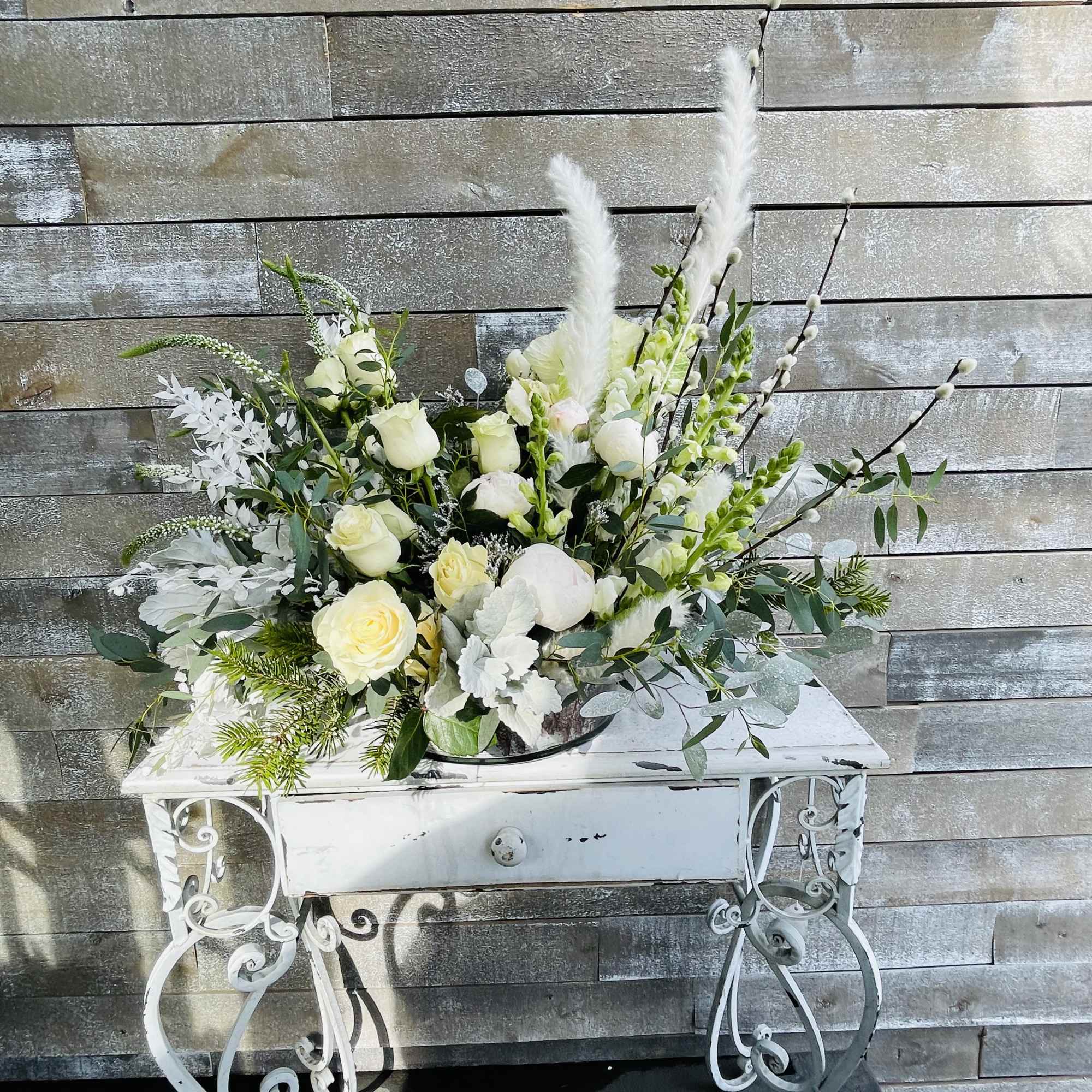Soft eclectic palette of whites and creams accented with preserved bleached flowers Soft eclectic palette of whites and creams accented with preserved bleached flowers