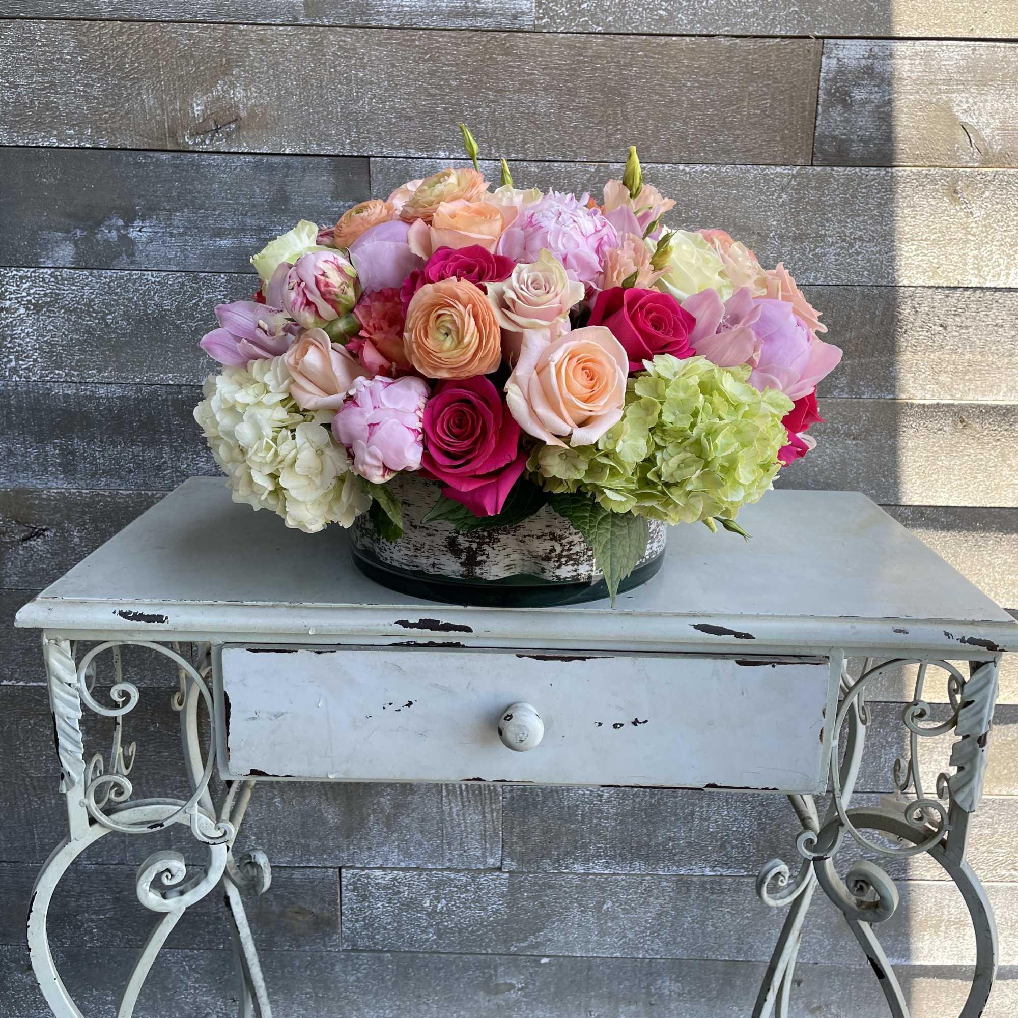 Peonies, roses, ranunculus, lisianthus  and hydrangeas create the perfect eclipse of Peonies, roses, ranunculus, lisianthus  and hydrangeas create the perfect eclipse of