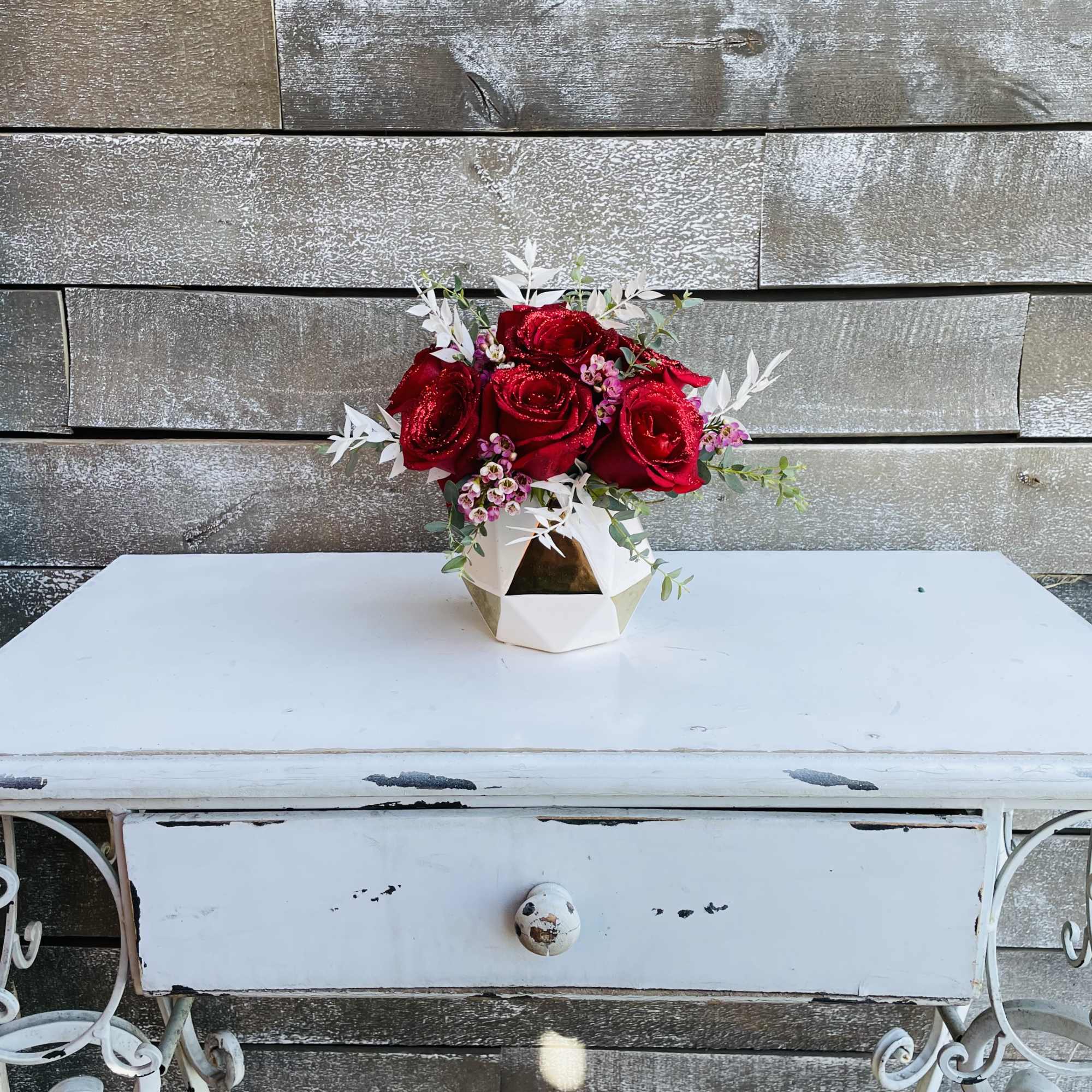 Half dozen red glitter roses with greens waxflower and dried preserved ruscus Half dozen red glitter roses with greens waxflower and dried preserved ruscus