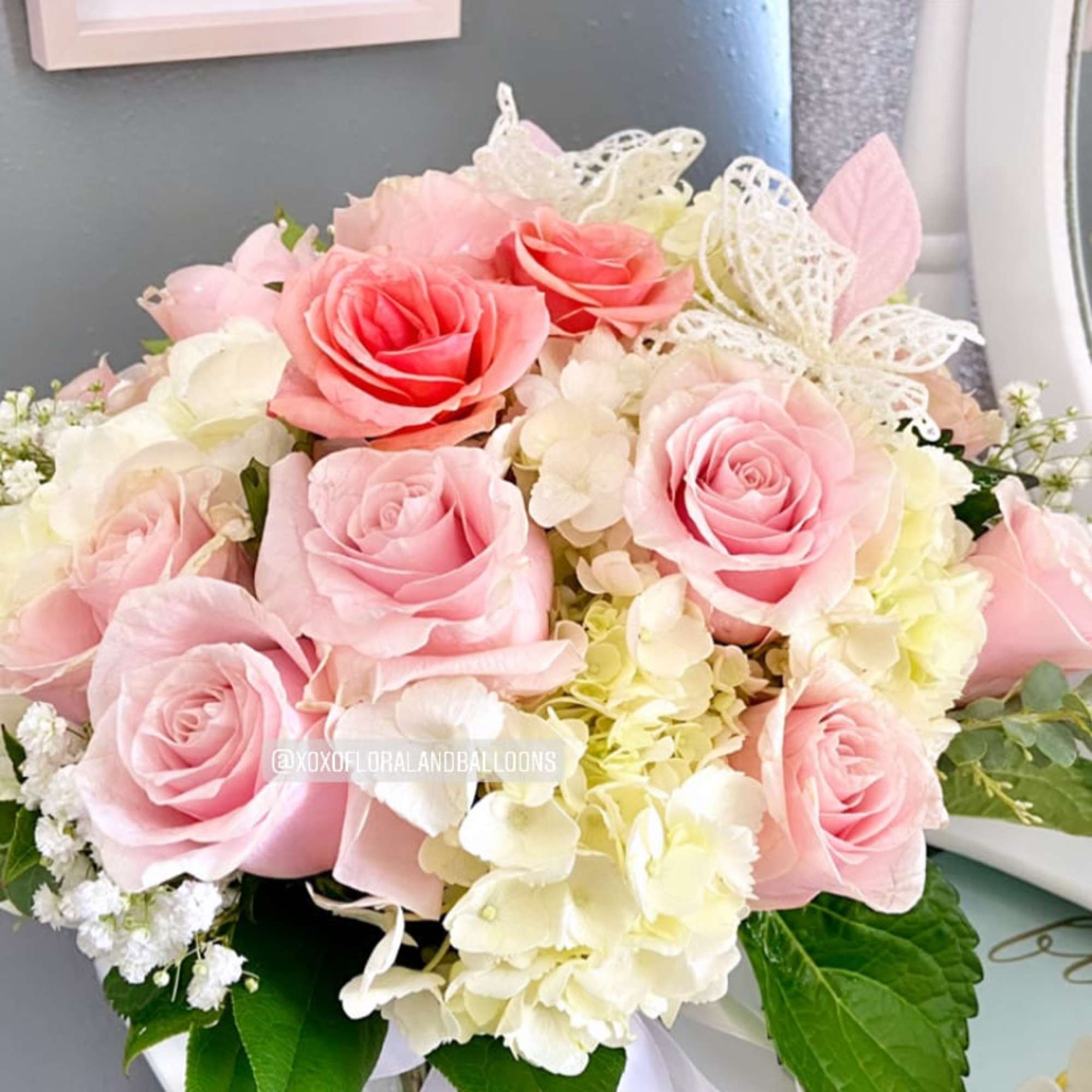Hey love! This lovely arrangement is composed of White hydrangeas, soft pink