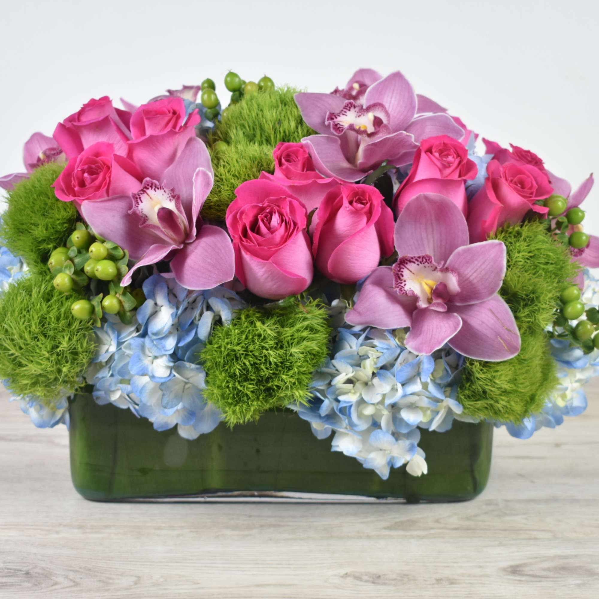 This Sweet and Unique floral design come in a glass rectangular Vase