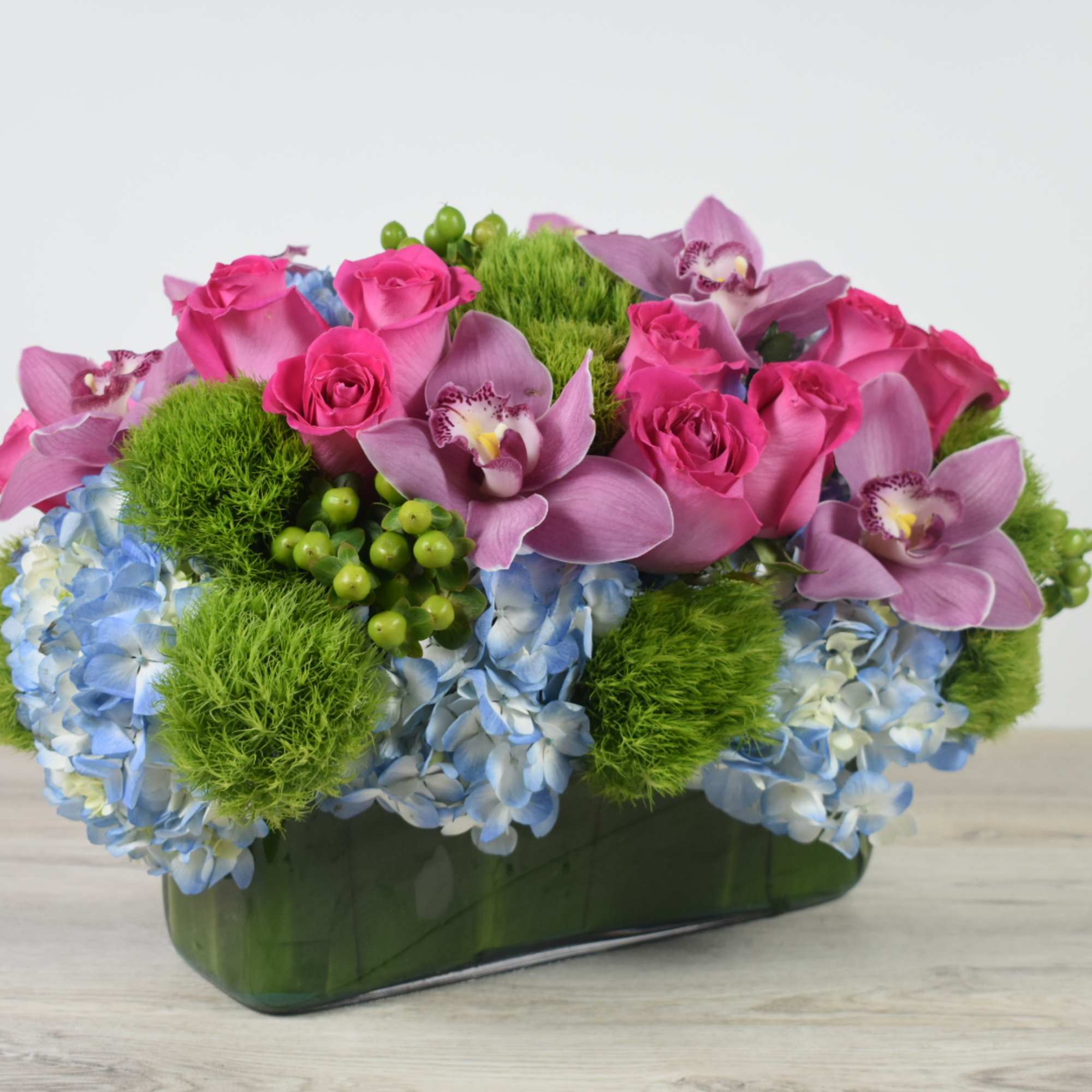 This Sweet and Unique floral design come in a glass rectangular Vase