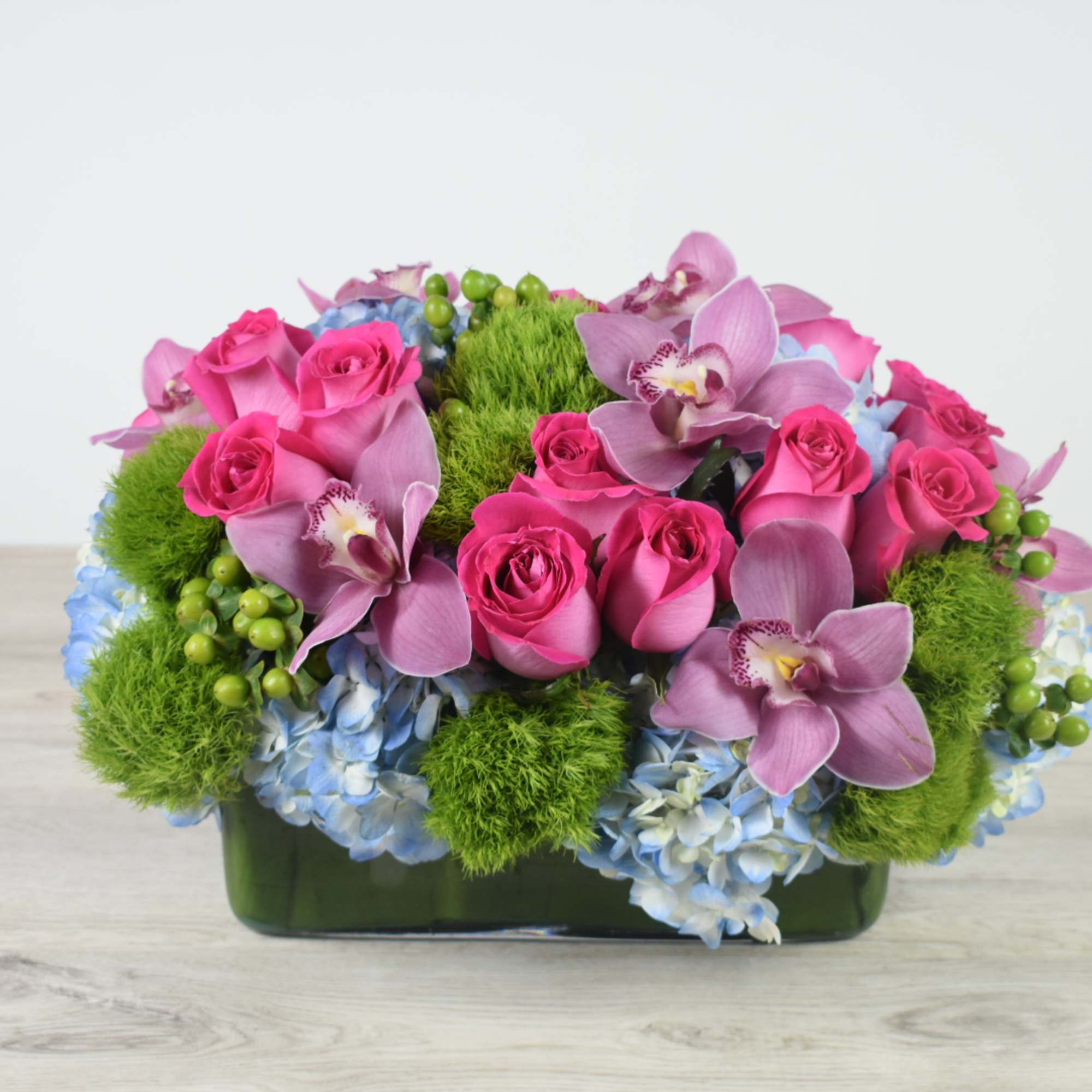 This Sweet and Unique floral design come in a glass rectangular Vase